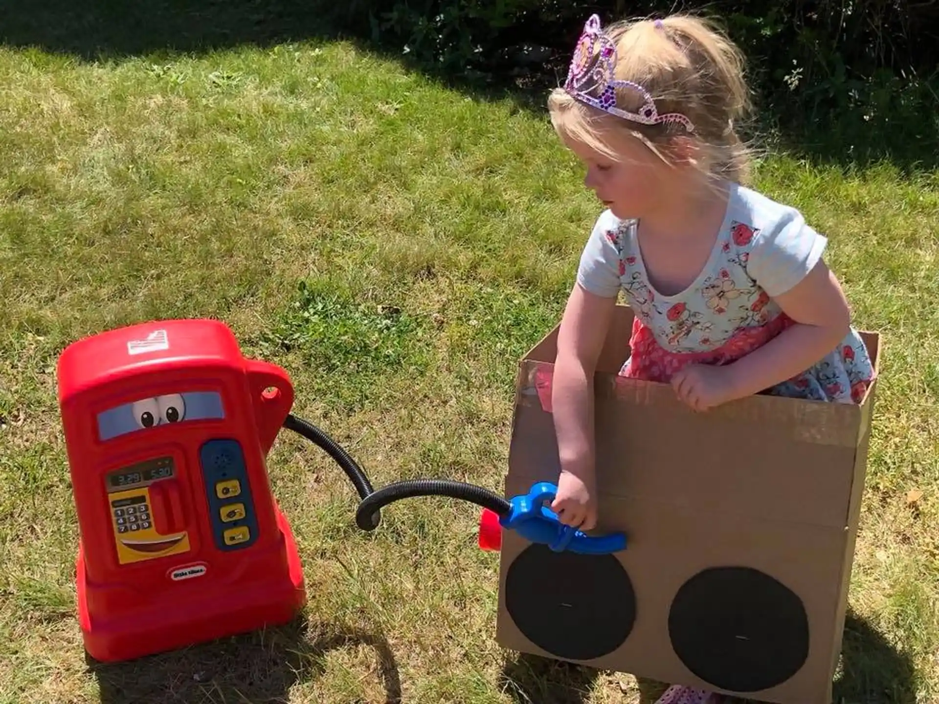 a little girl playing with a toy