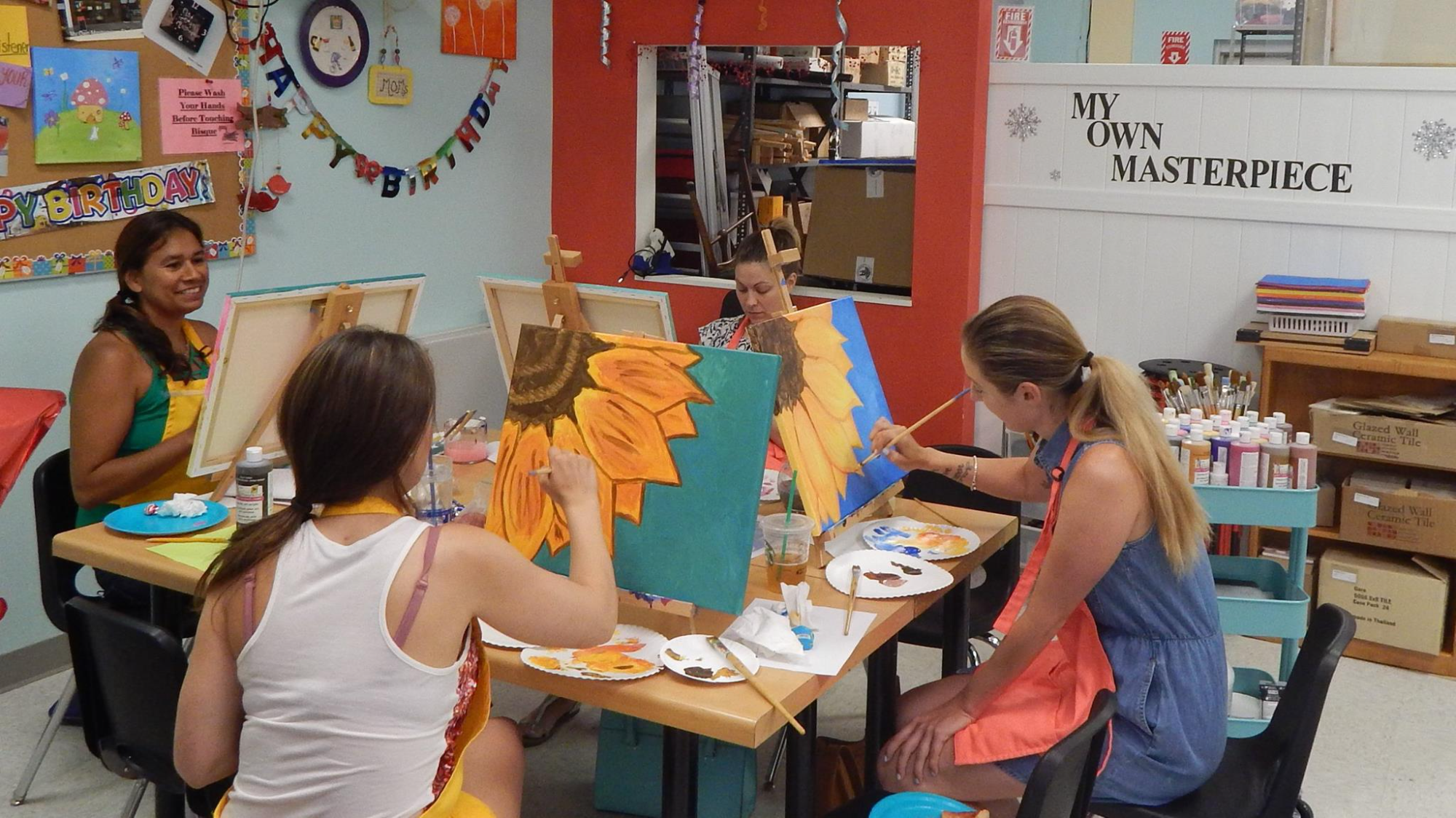 a group of people painting