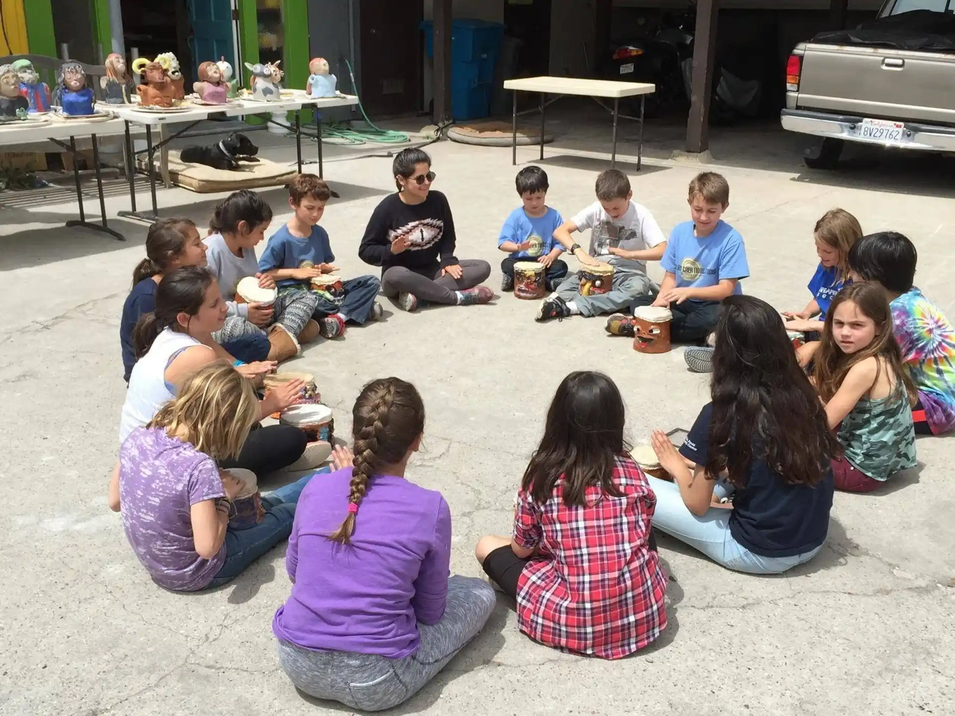a group of people sitting on the ground