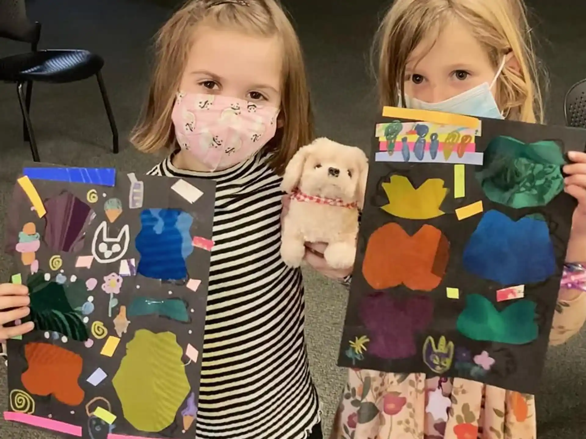 a couple of girls holding books