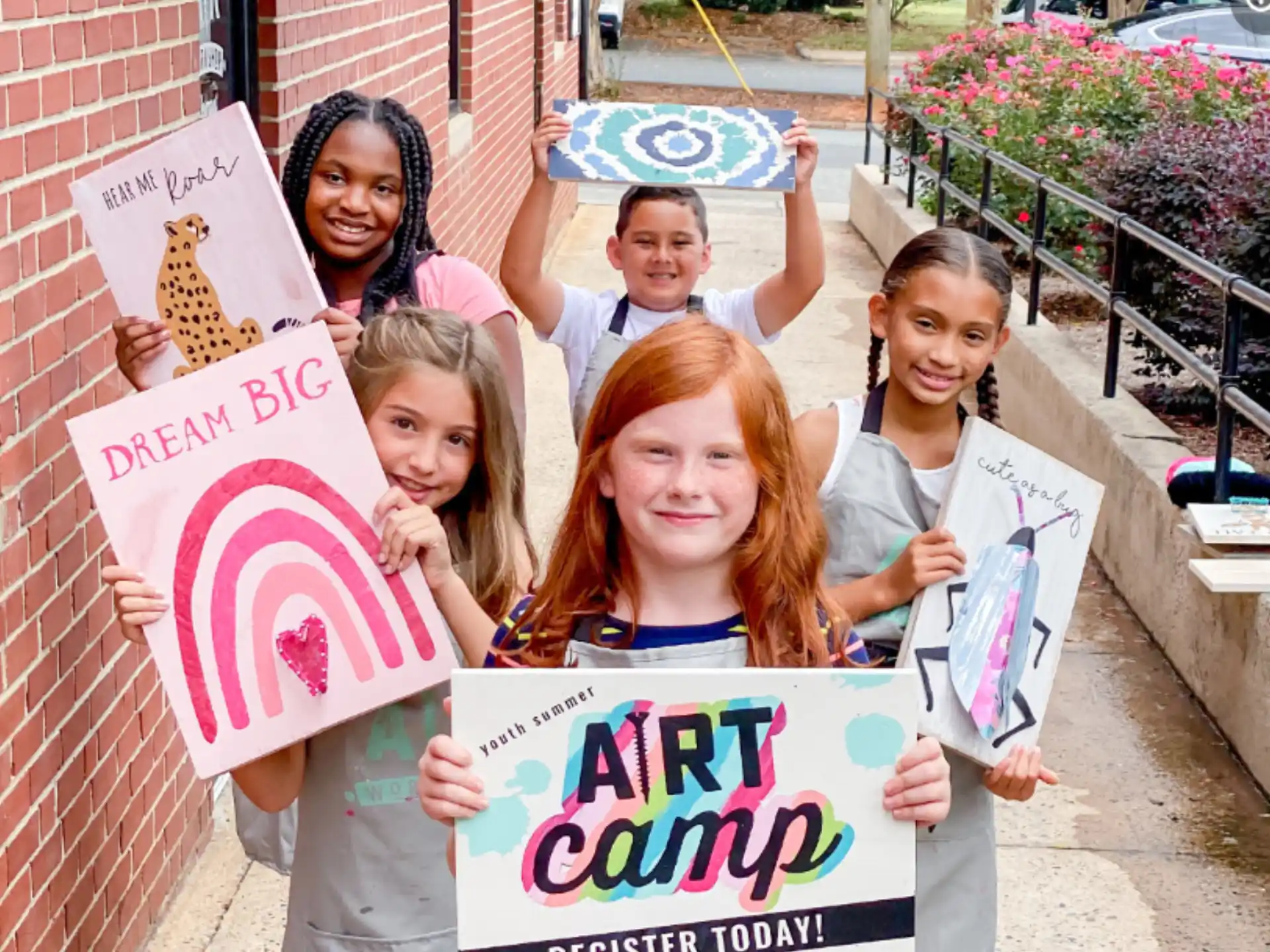a group of children holding signs