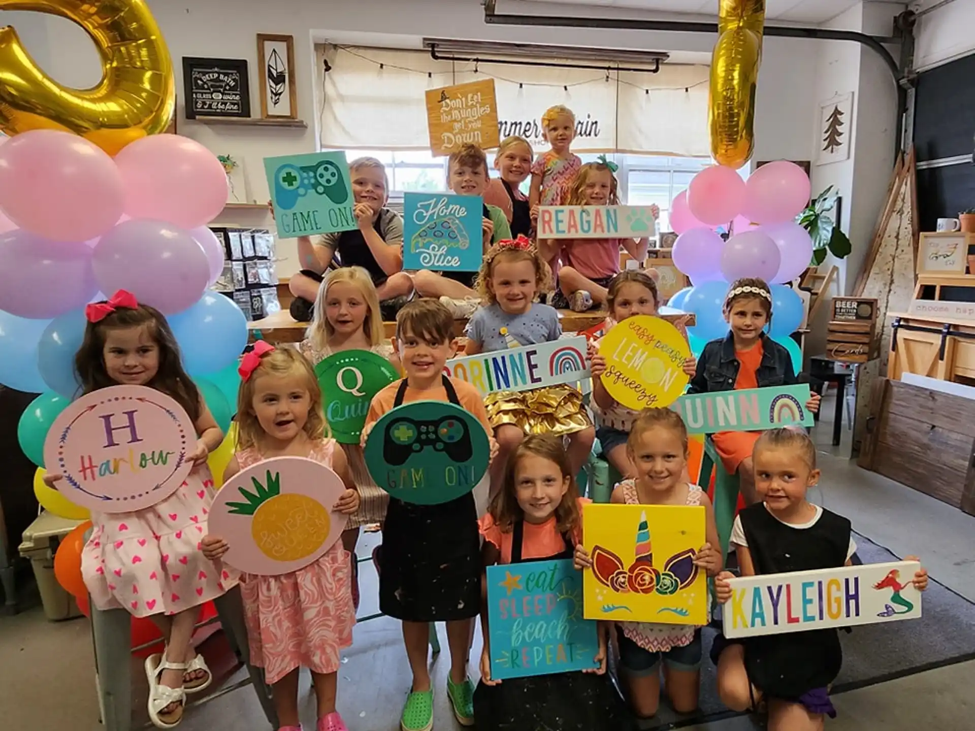a group of children holding balloons
