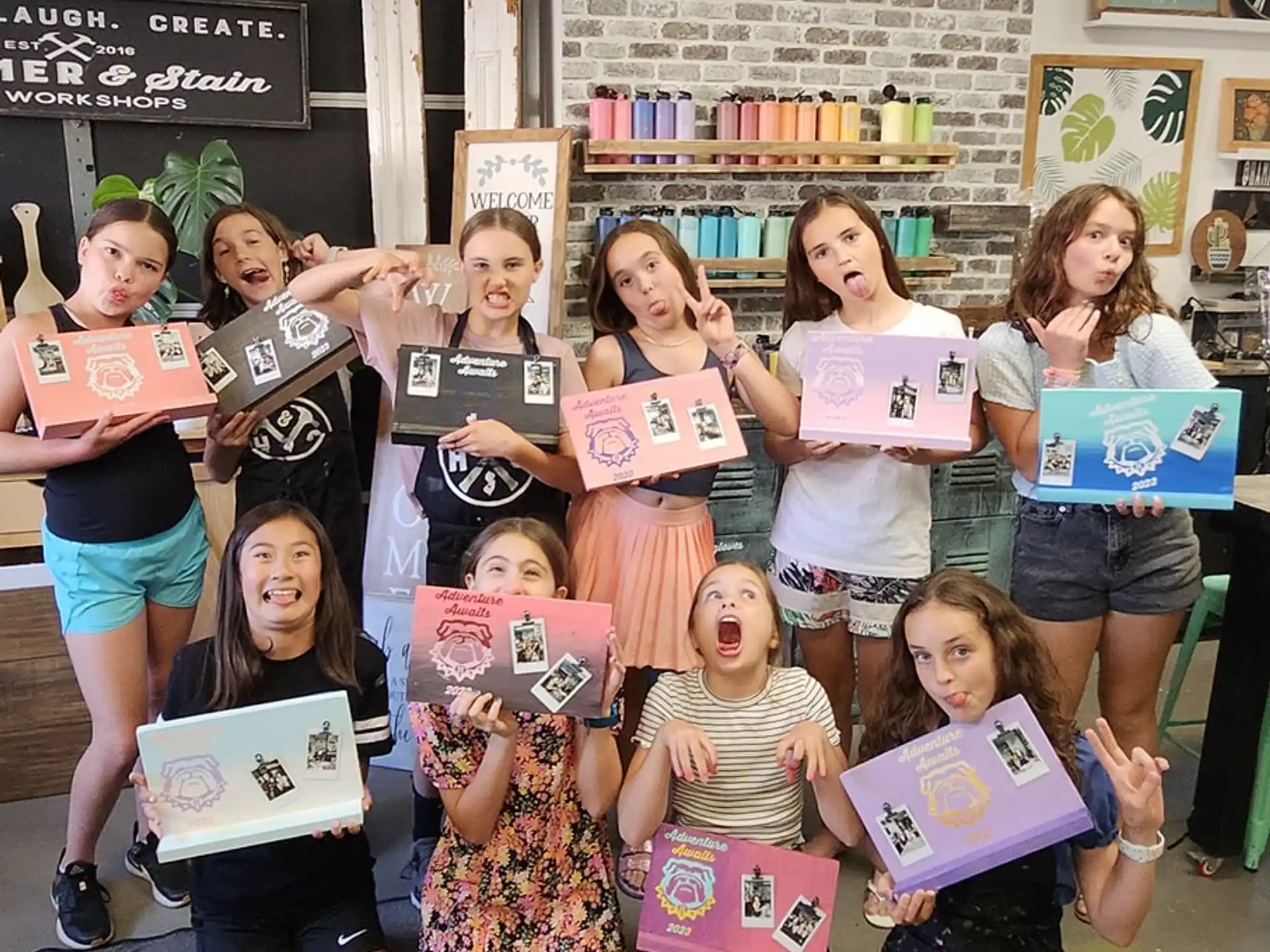 a group of girls holding signs
