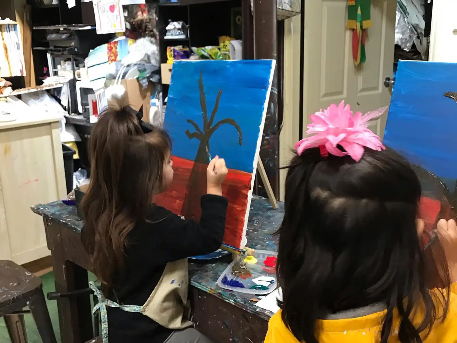 a group of girls painting