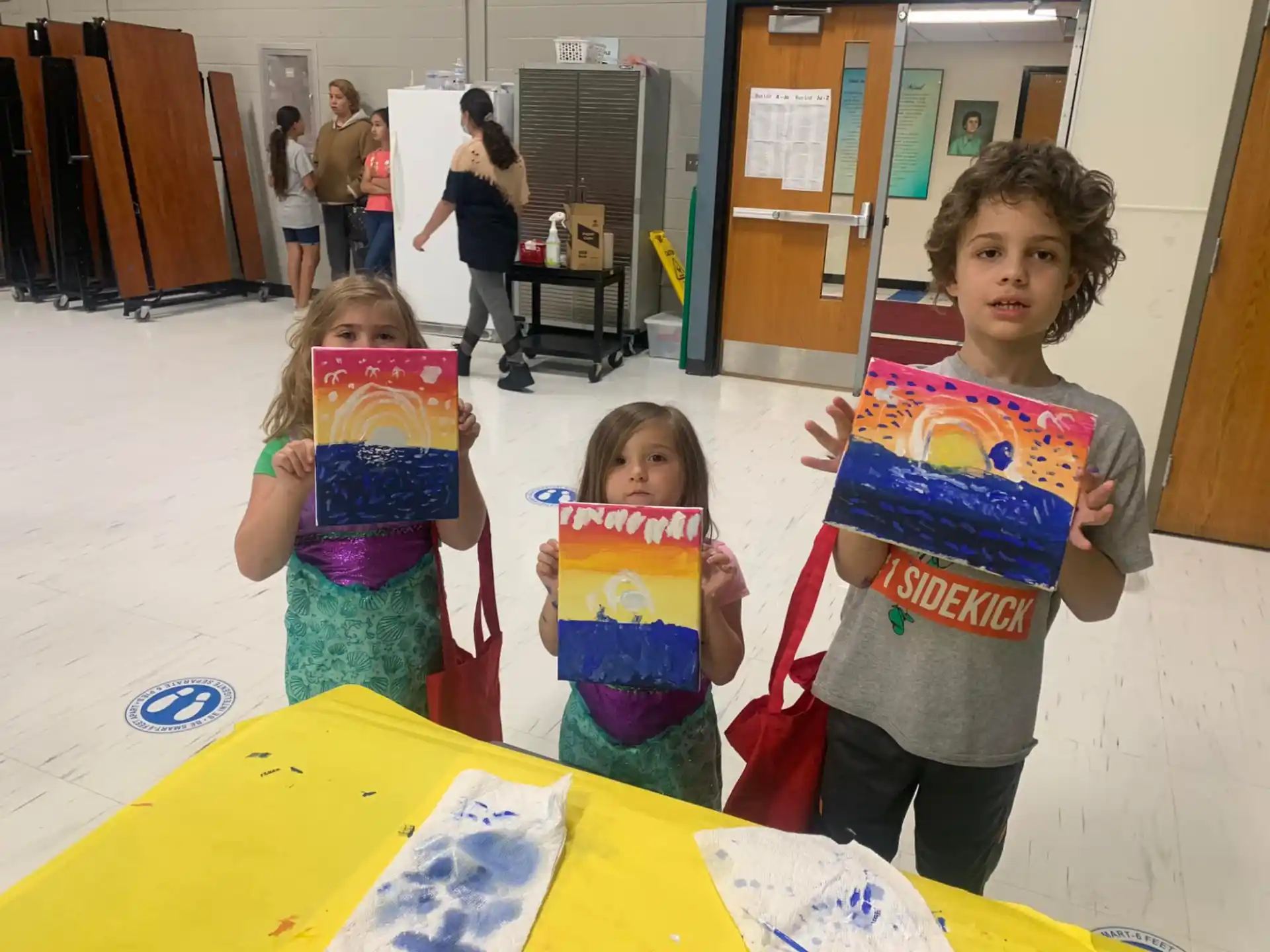 a group of children holding signs