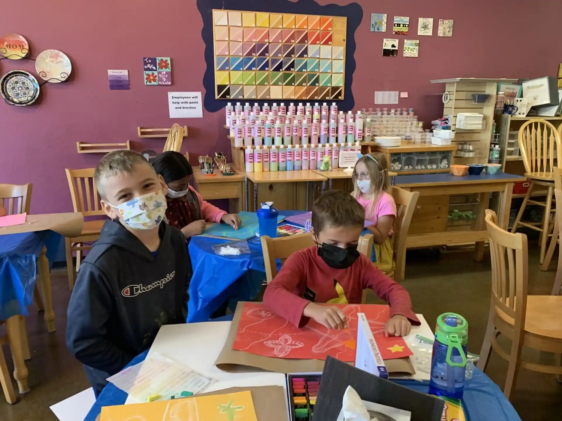 a group of children wearing masks