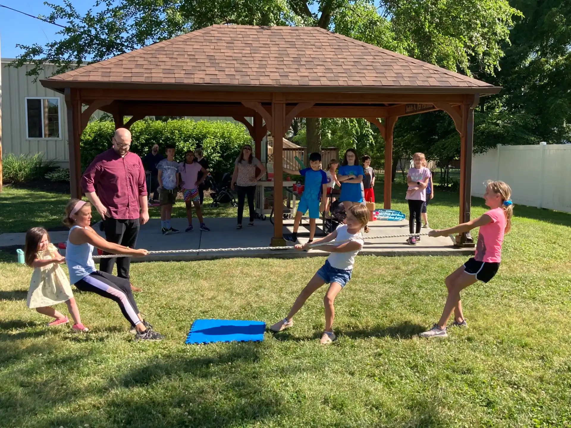 a group of children playing in a yard