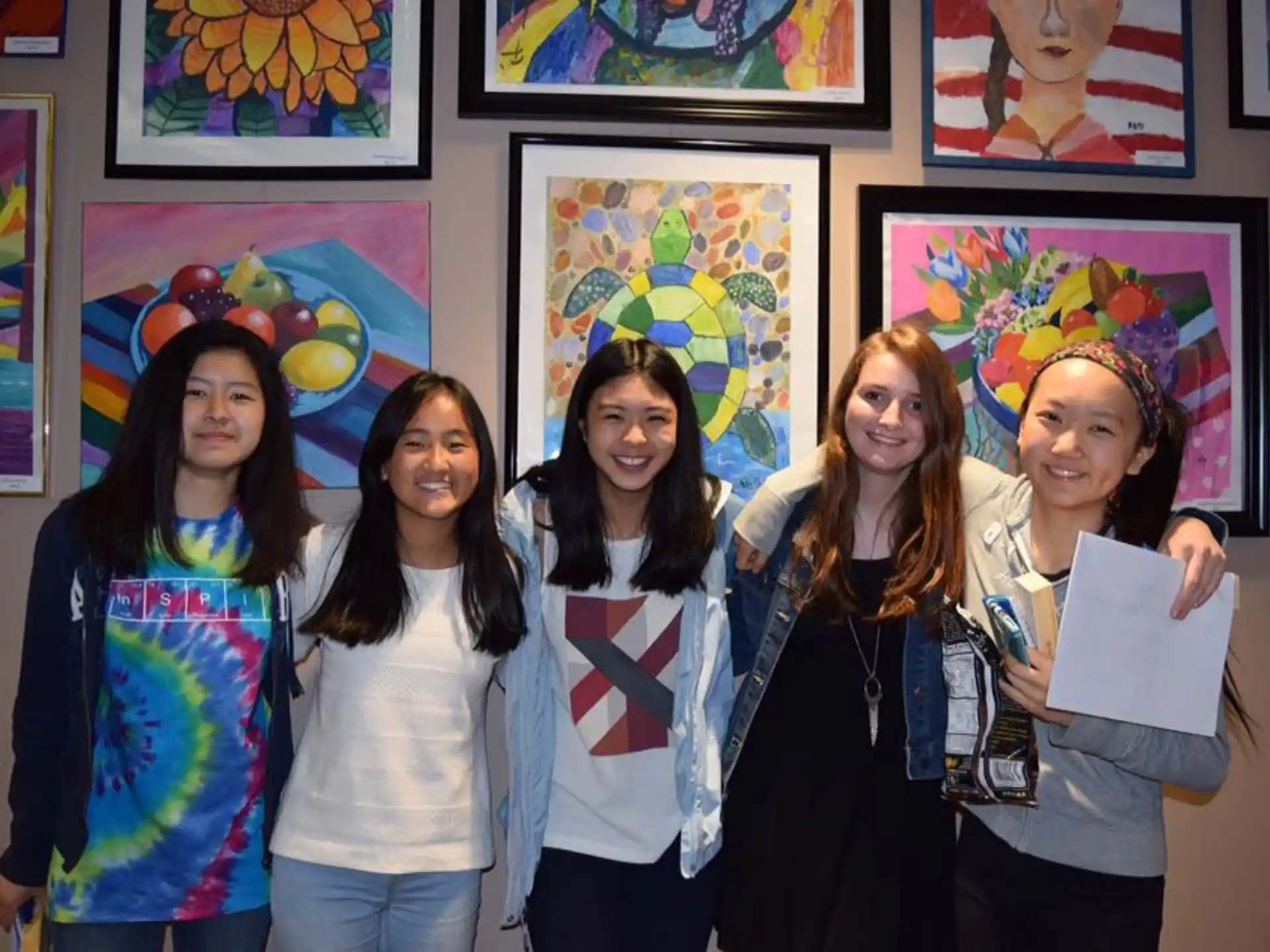 a group of women posing for a photo