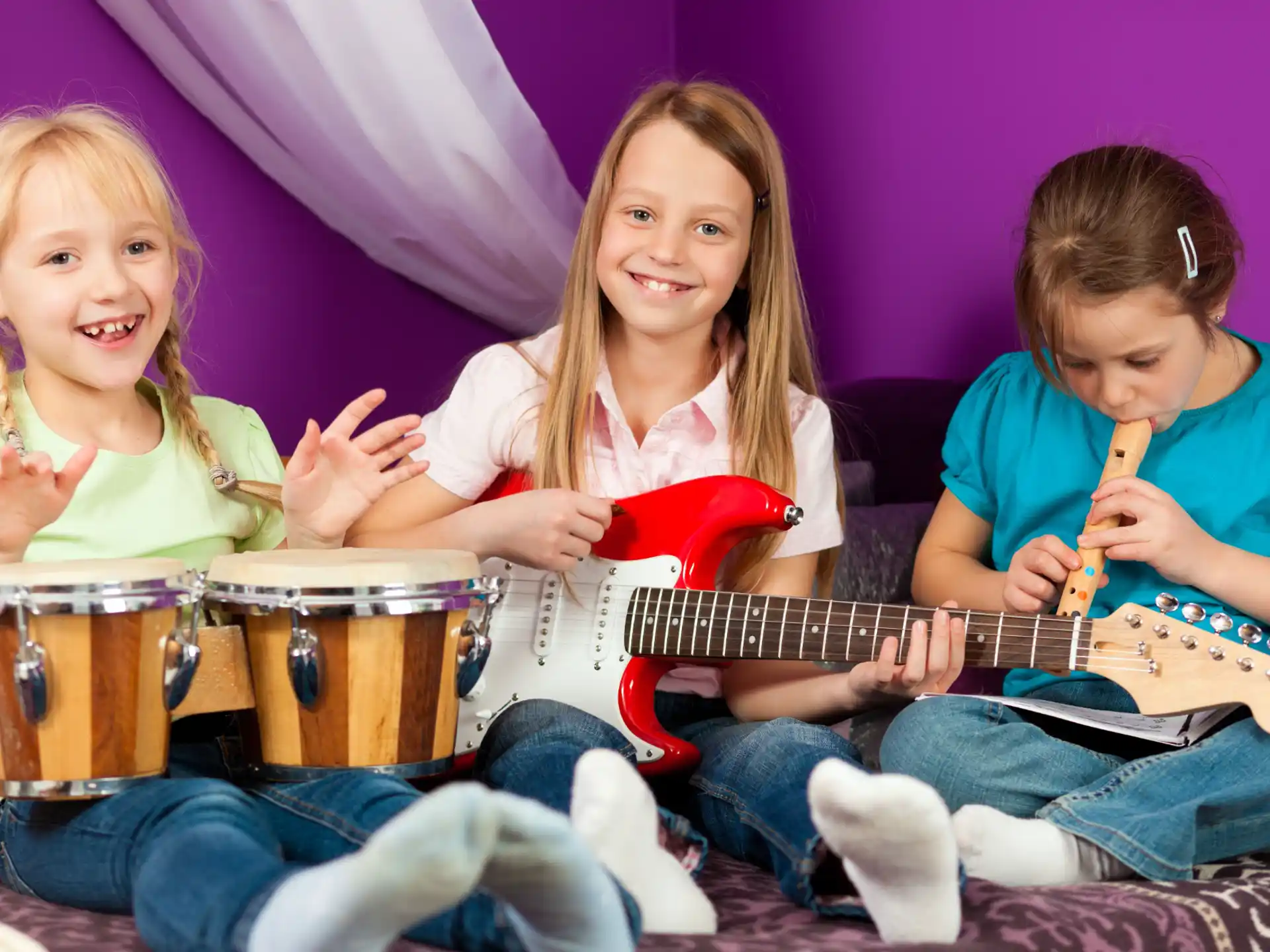 a group of kids playing instruments