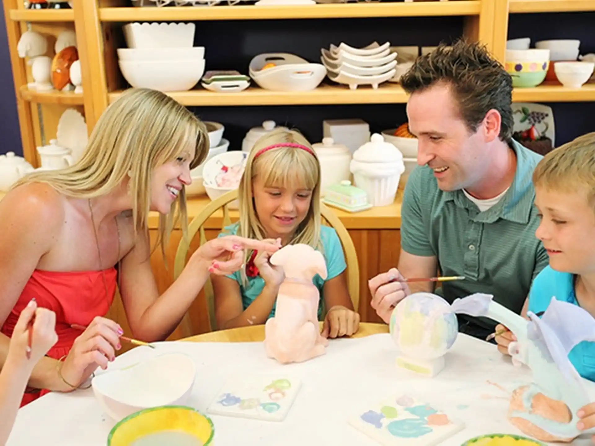a group of children sitting at a table