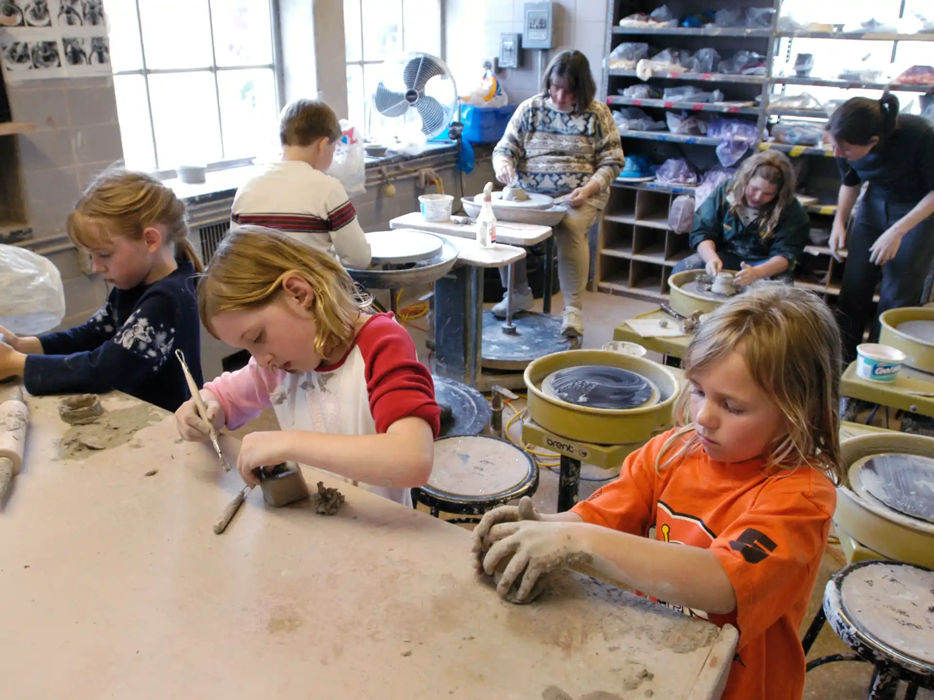 a group of children playing drums