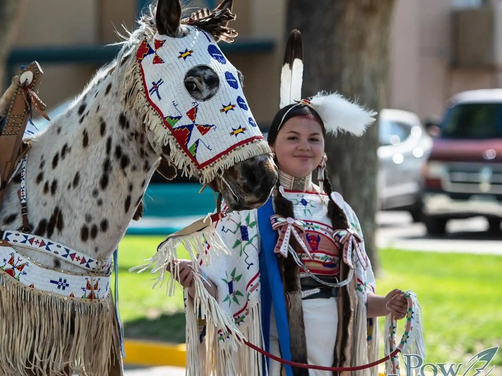 a person standing next to a horse
