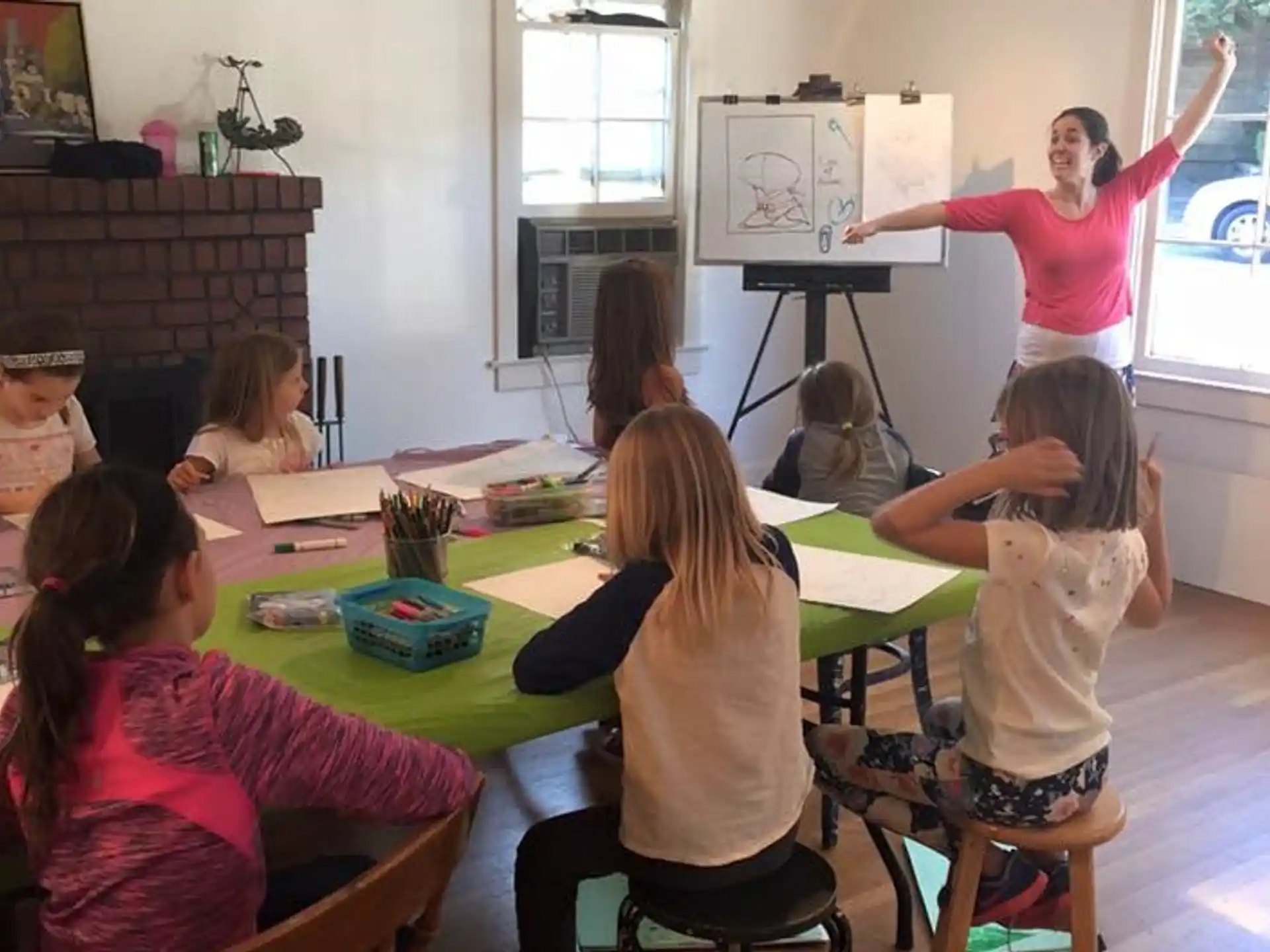 a person teaching a group of children