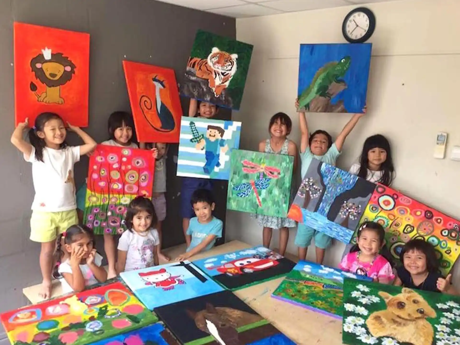 a group of children holding up posters