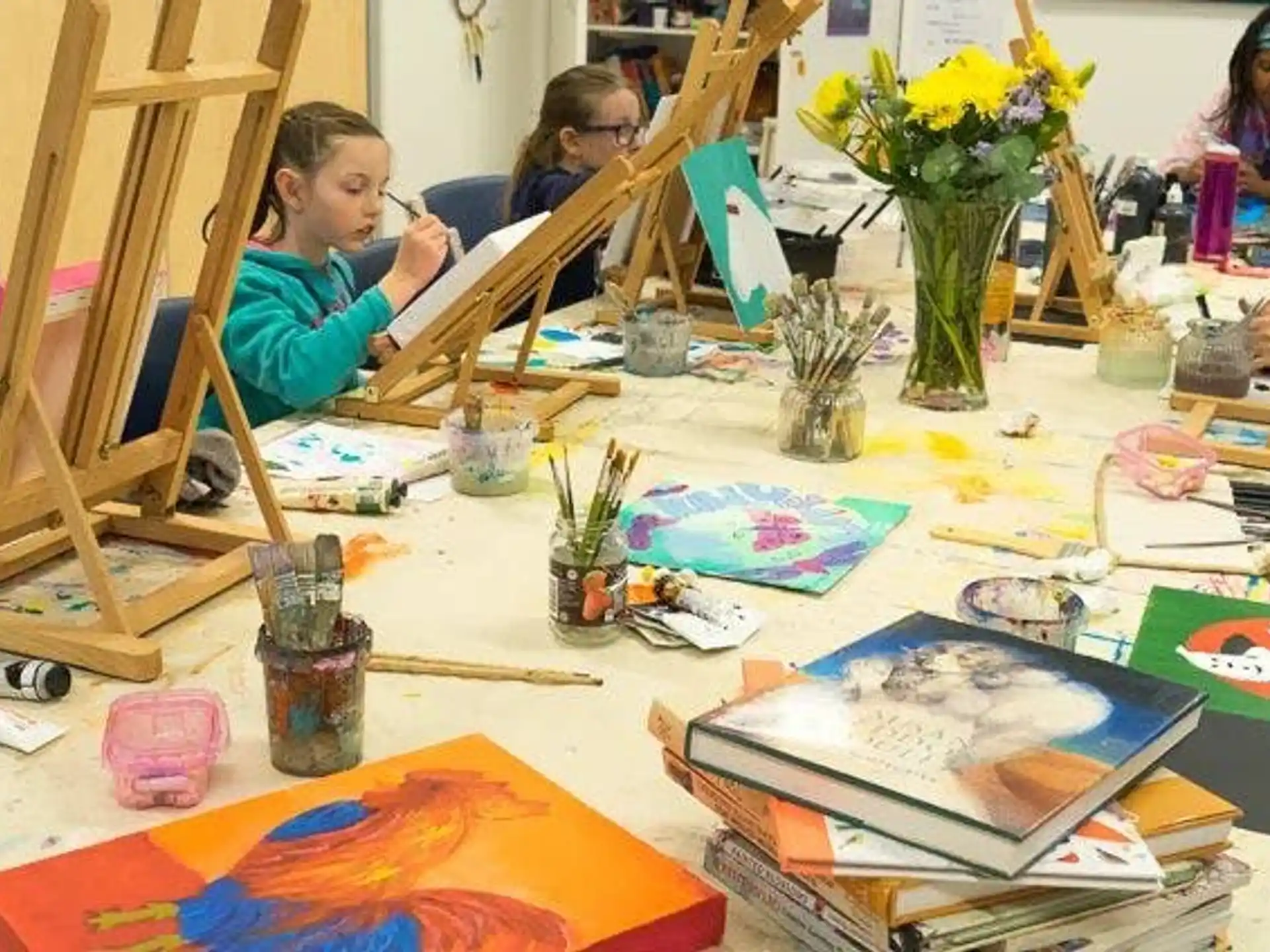 a group of children painting