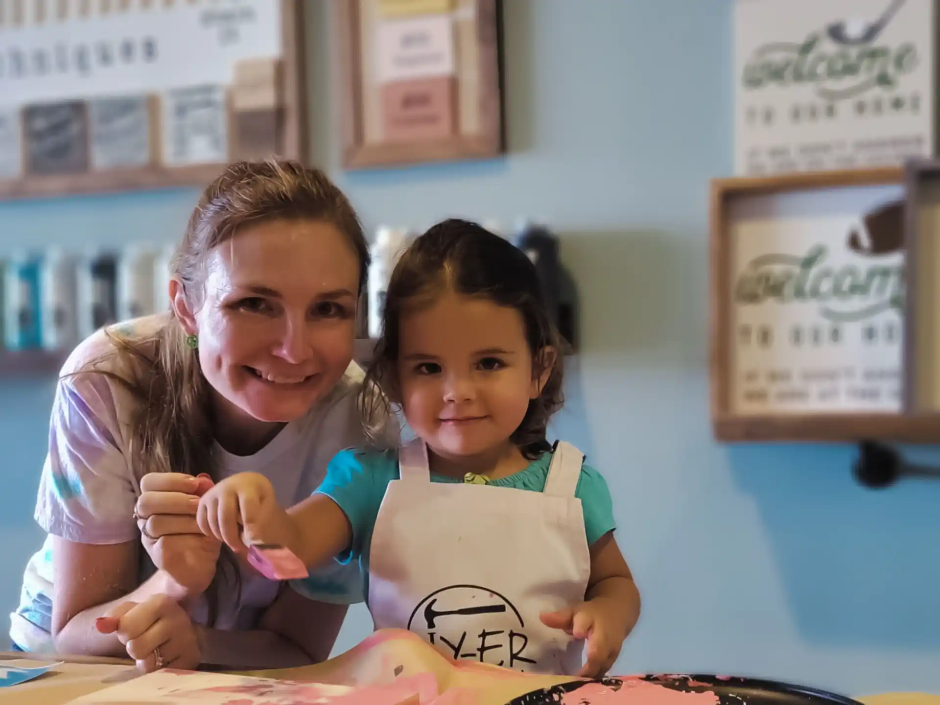 a person and a child posing for the camera