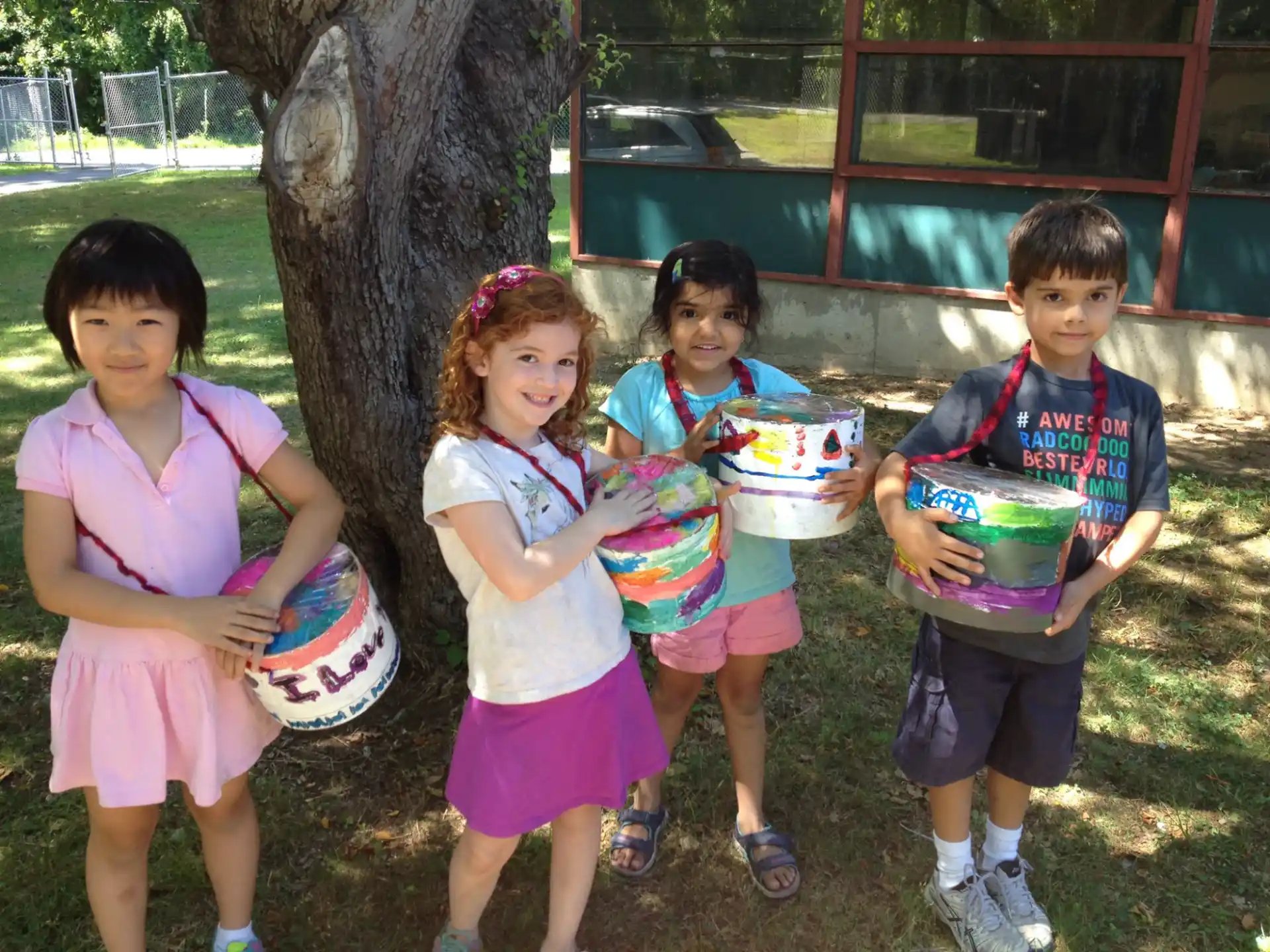 a group of children holding plates of food