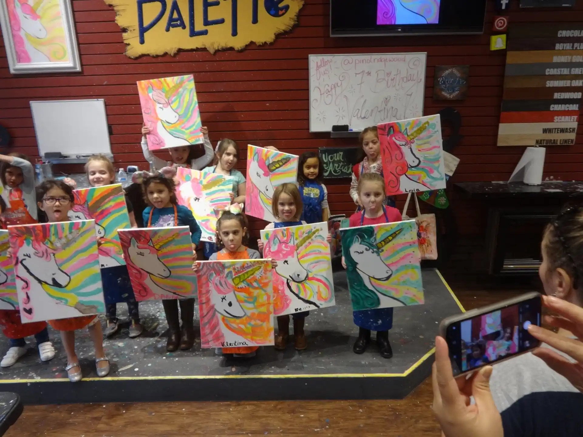 a group of children in colorful dresses