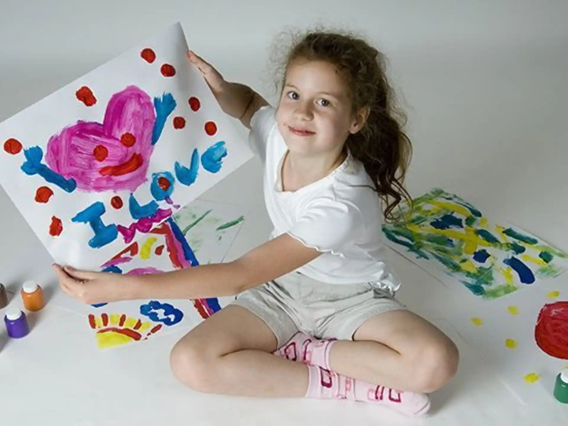 a girl sitting on a bed