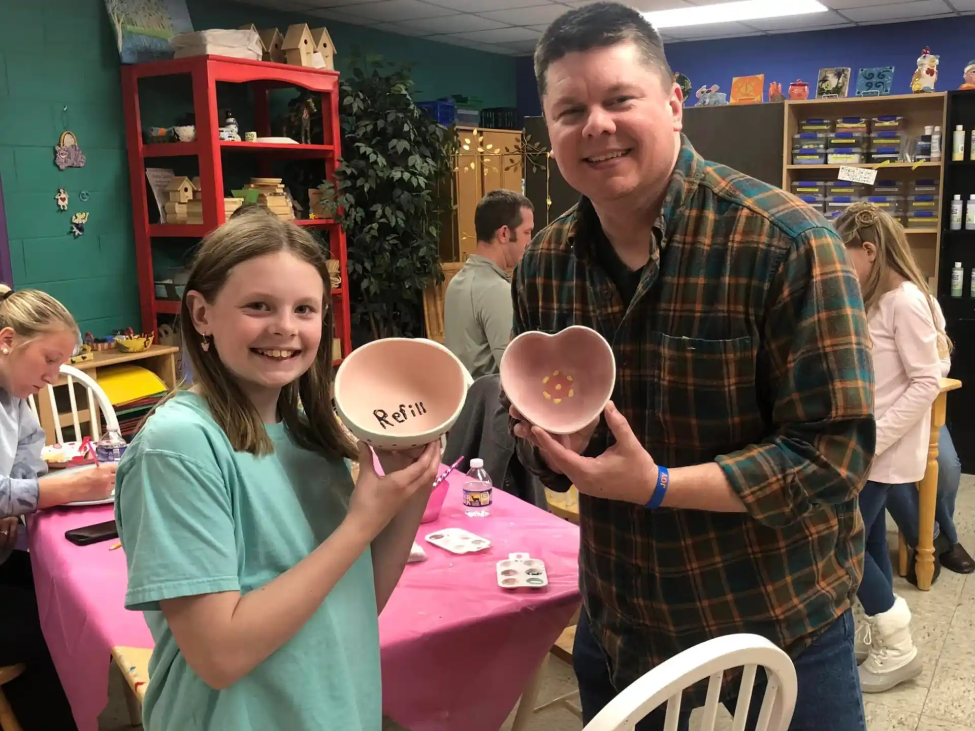 a man and a woman holding bowls