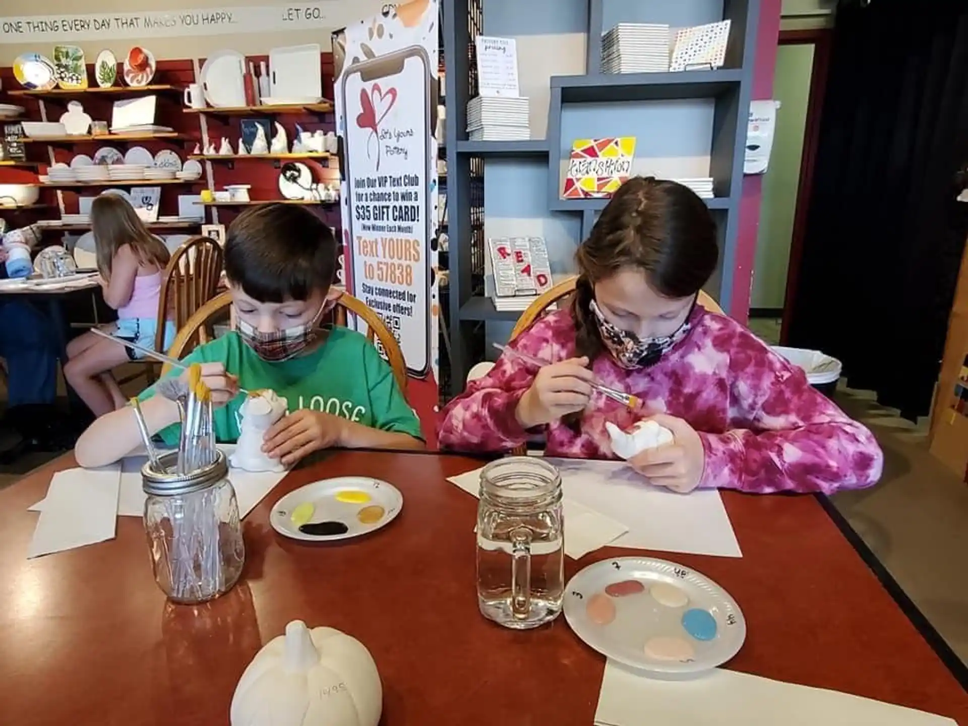 a person and a child sitting at a table
