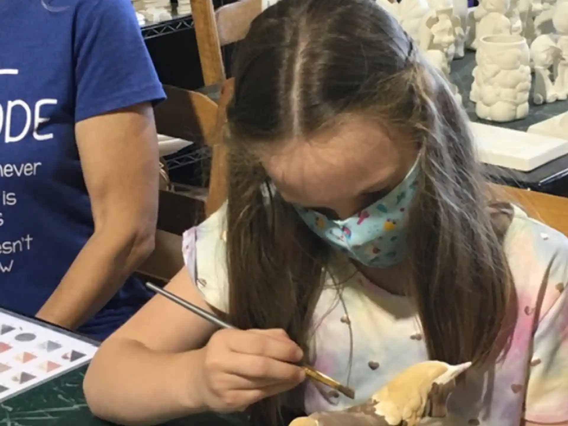 a young girl painting