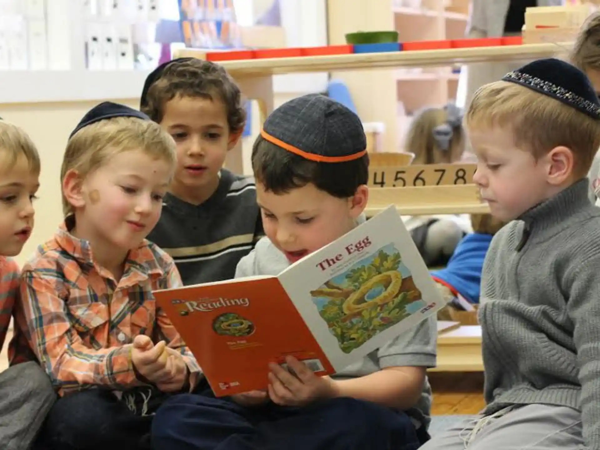 a group of children sitting in a classroom
