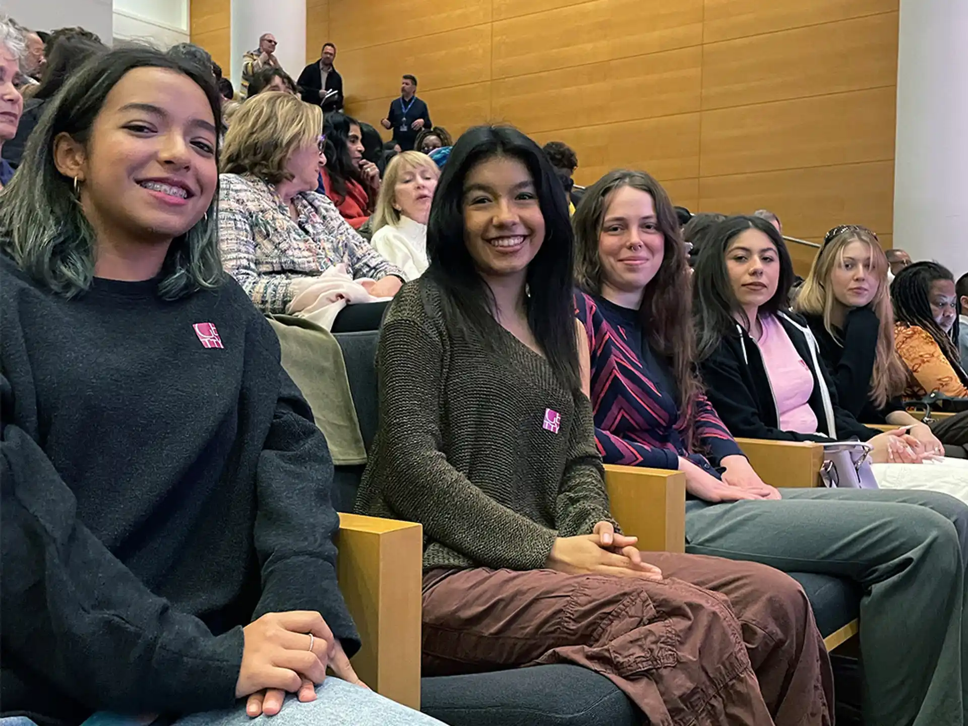 a group of women sitting in chairs