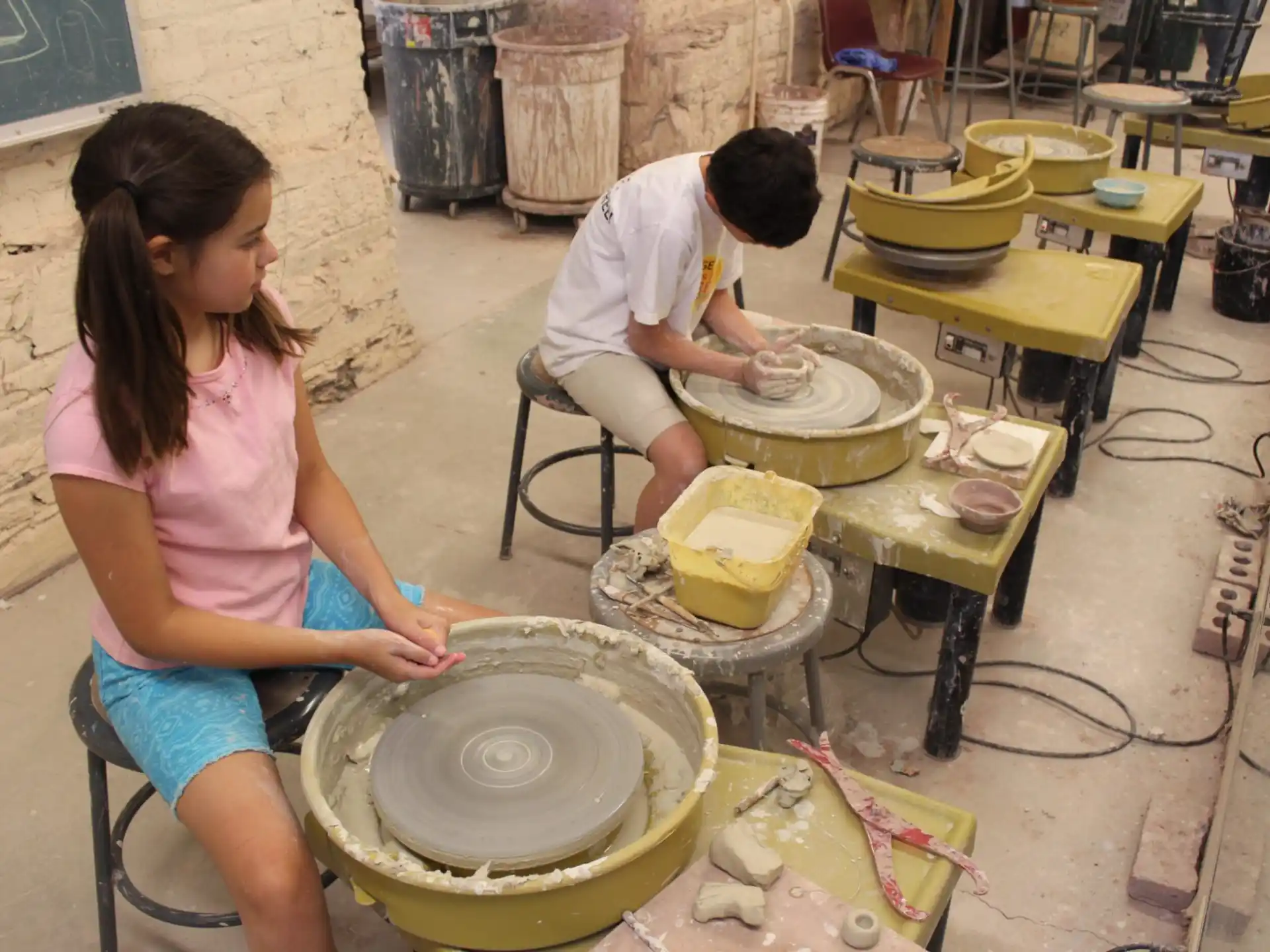 a man and a woman playing drums