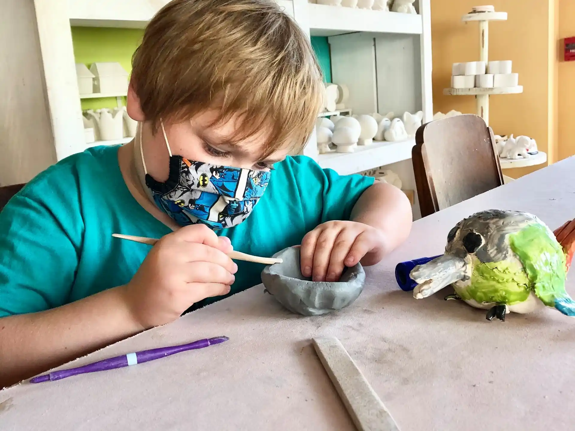 a young boy painting