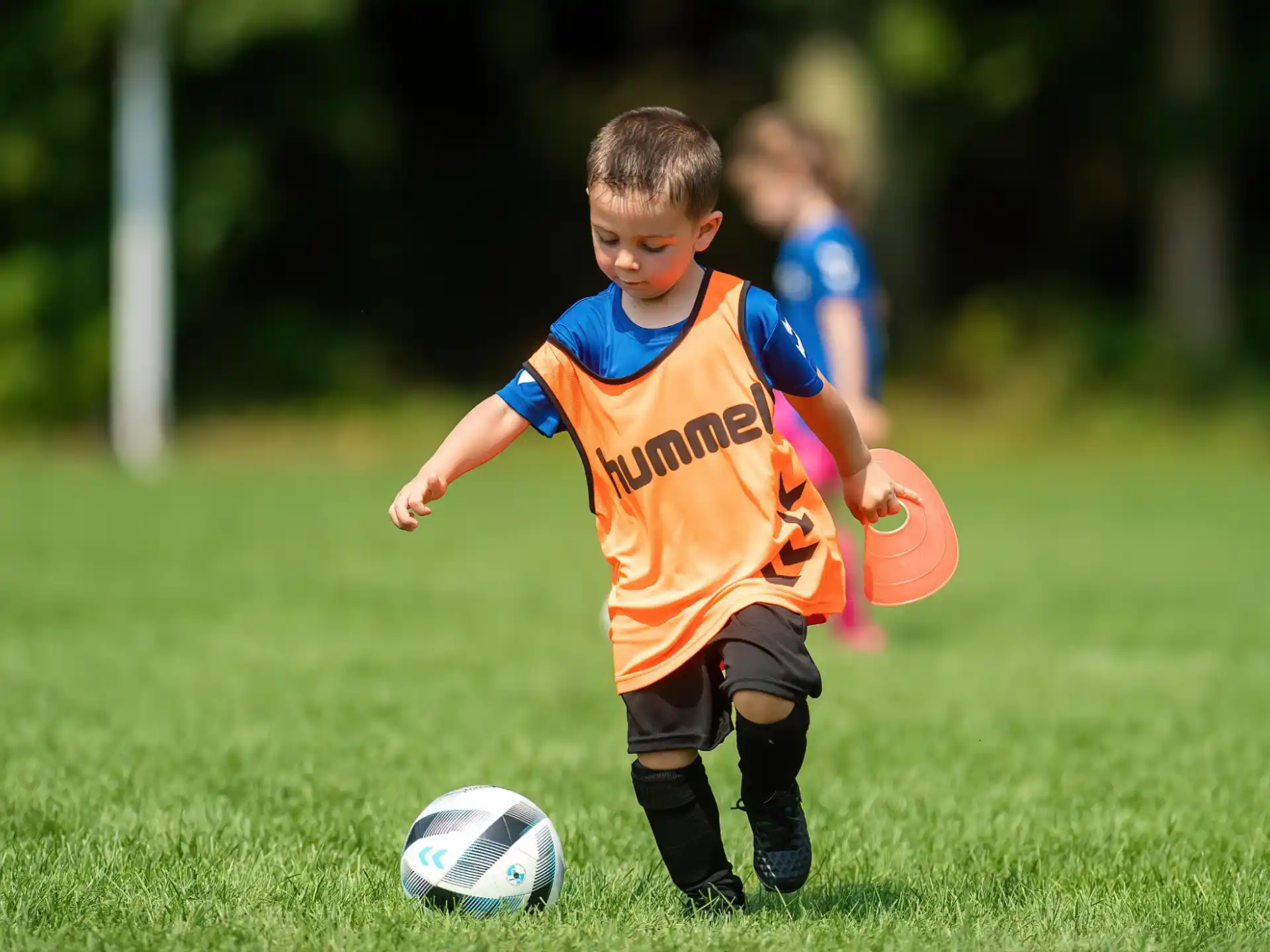 a kid playing football
