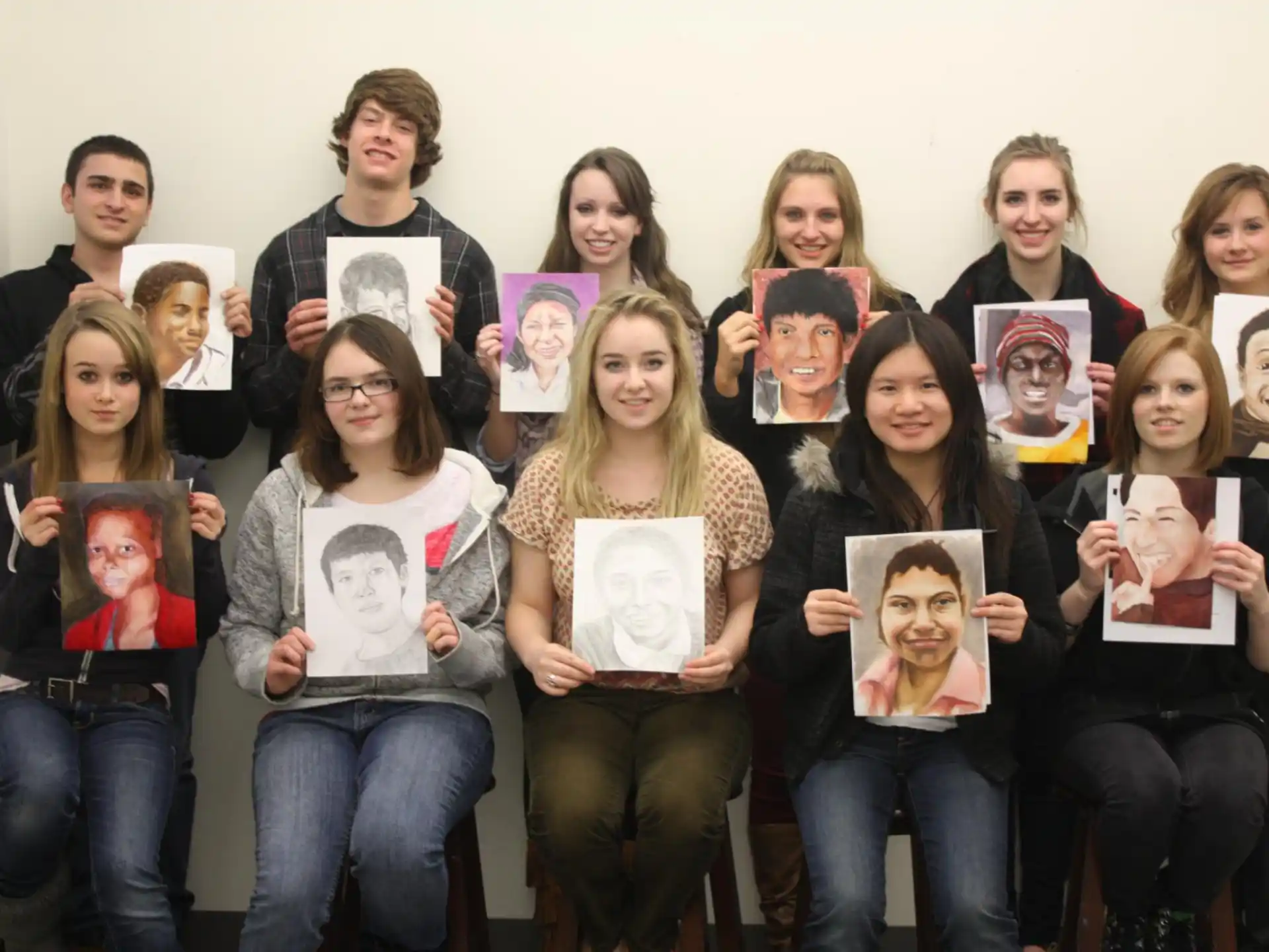 a group of people holding papers