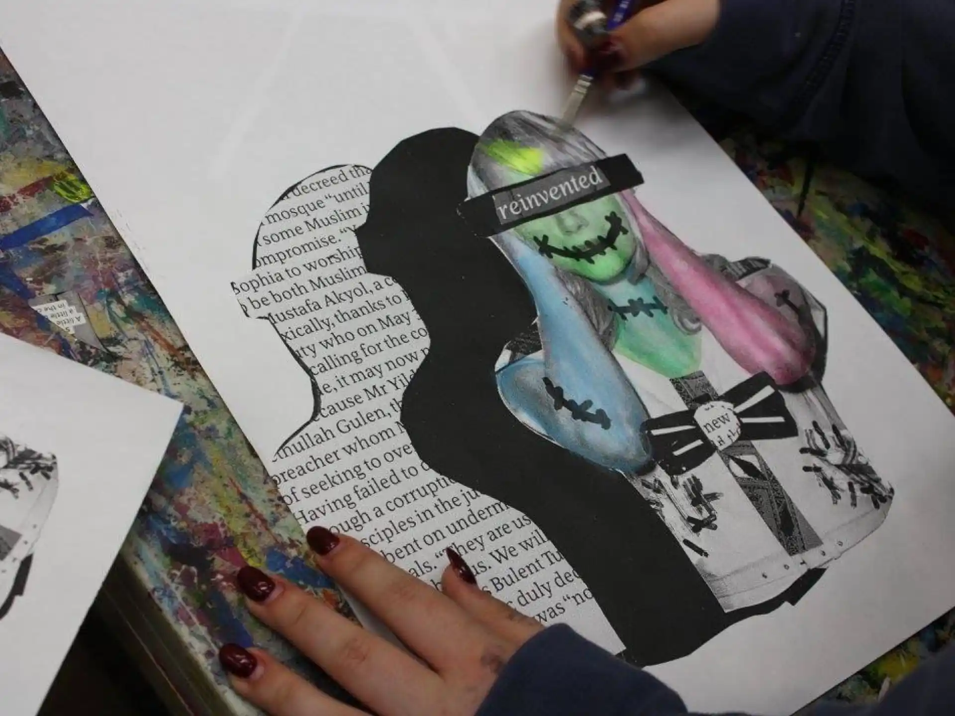 a person drawing on a paper