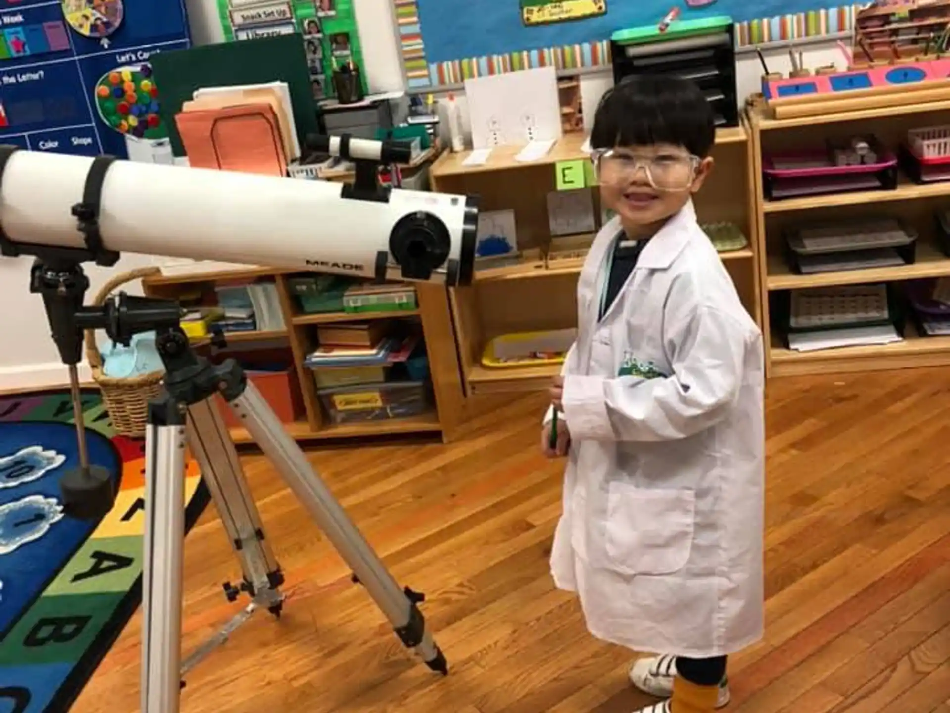 a young boy in a lab coat