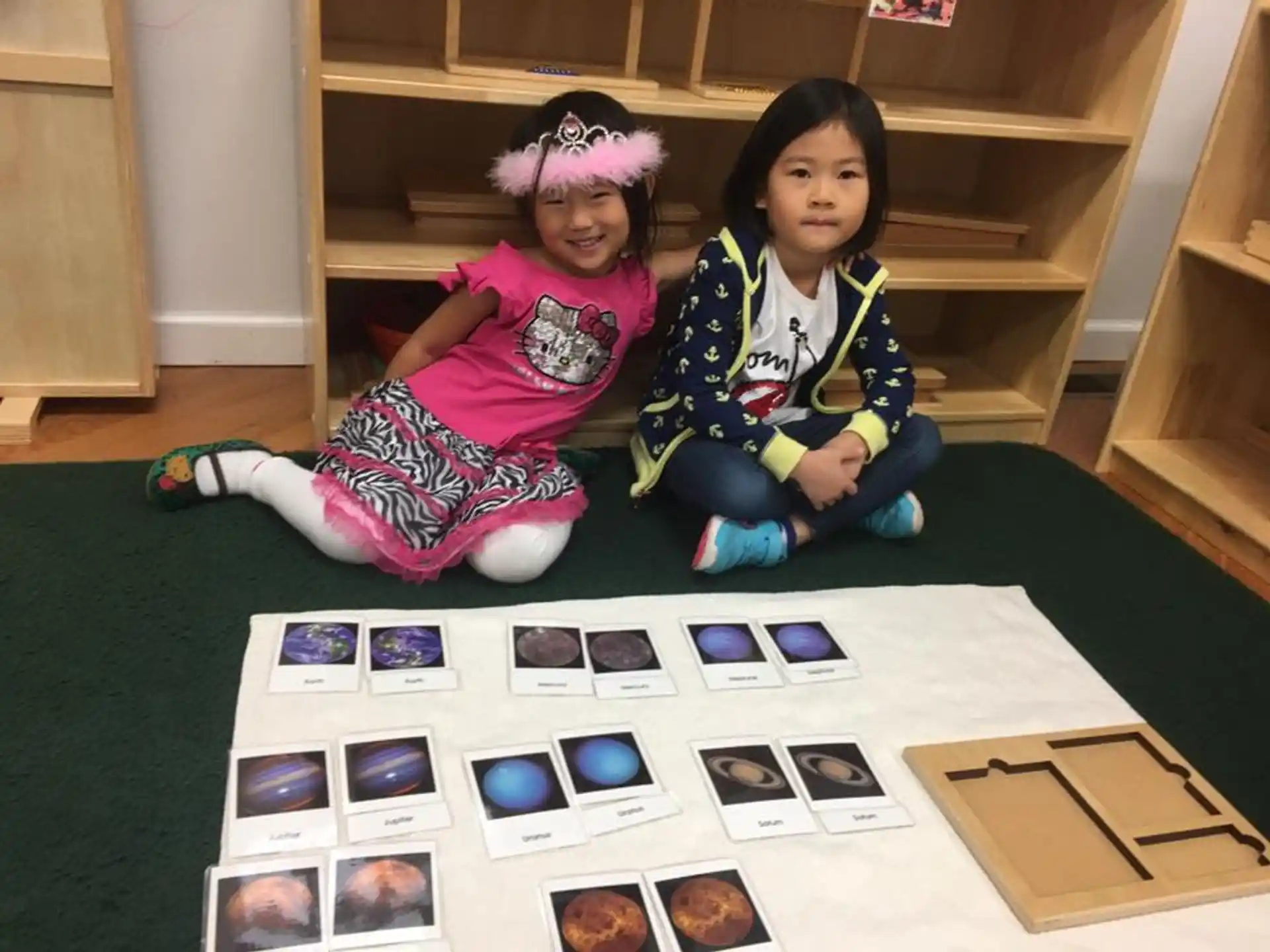 two children sitting on the floor