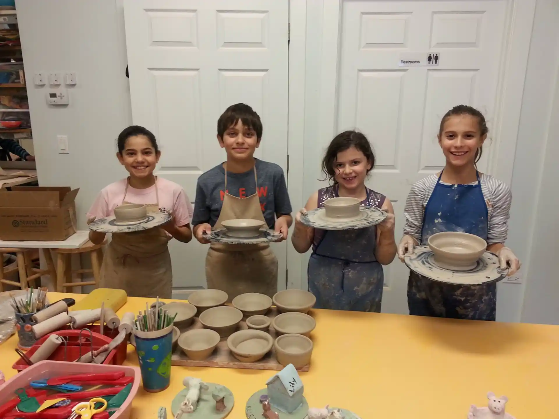 a group of people holding plates