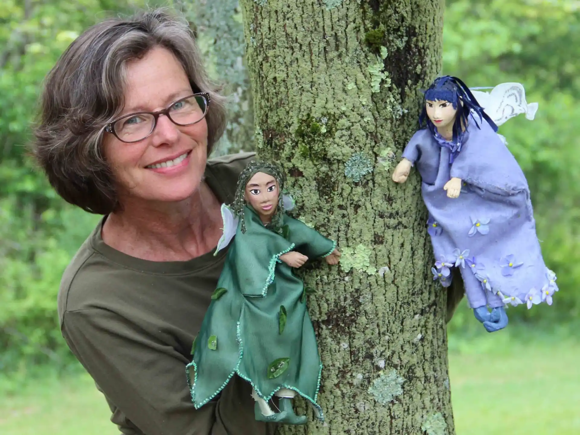 a person holding a baby in a tree