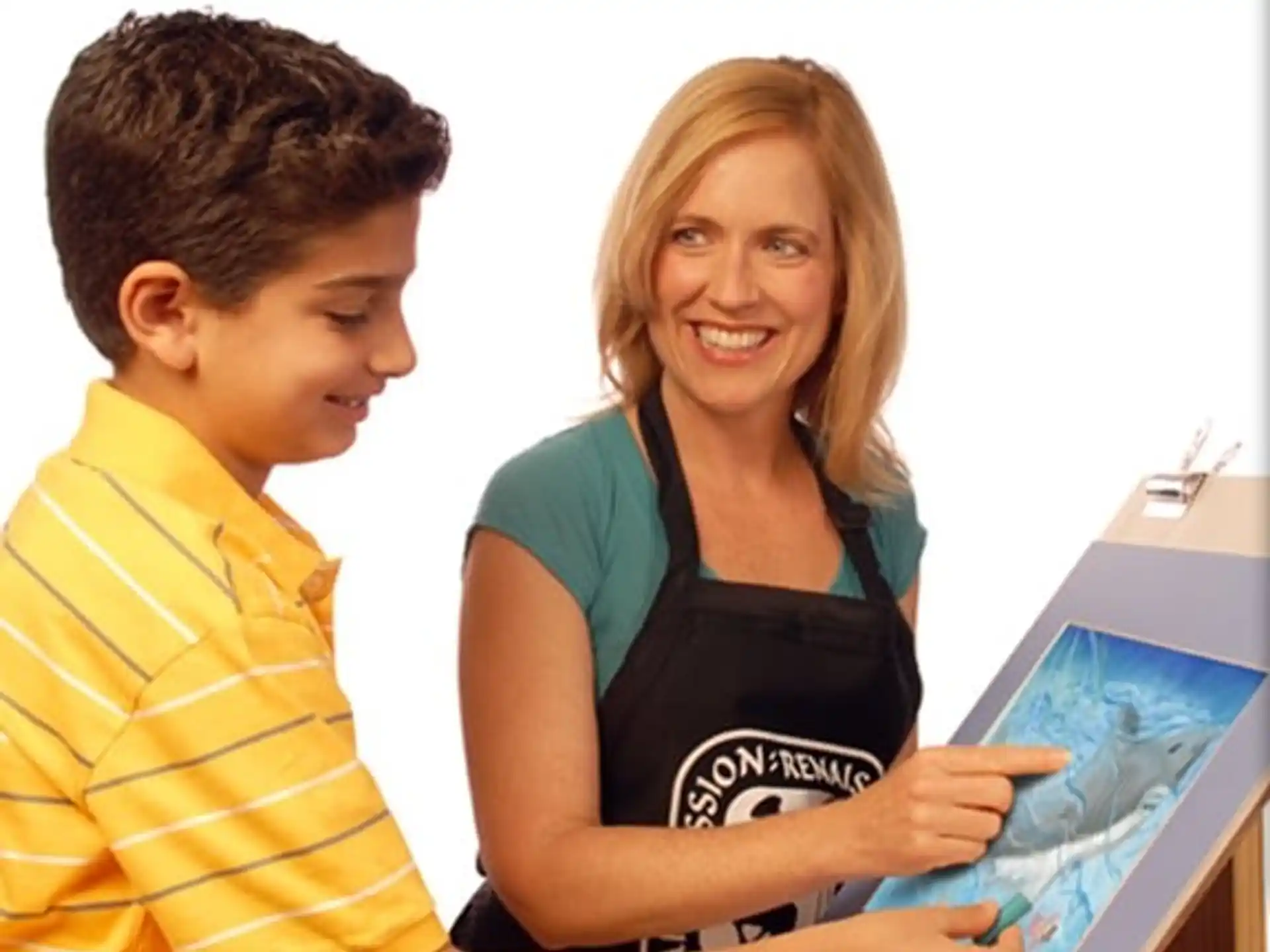 a person and a boy looking at a computer screen