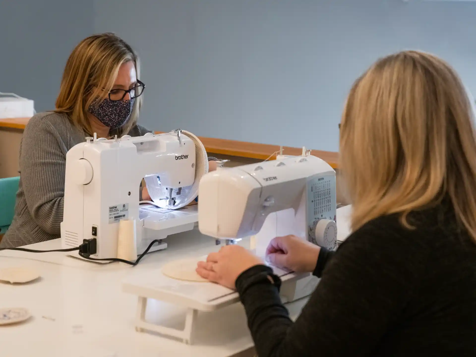 a person looking at a microscope