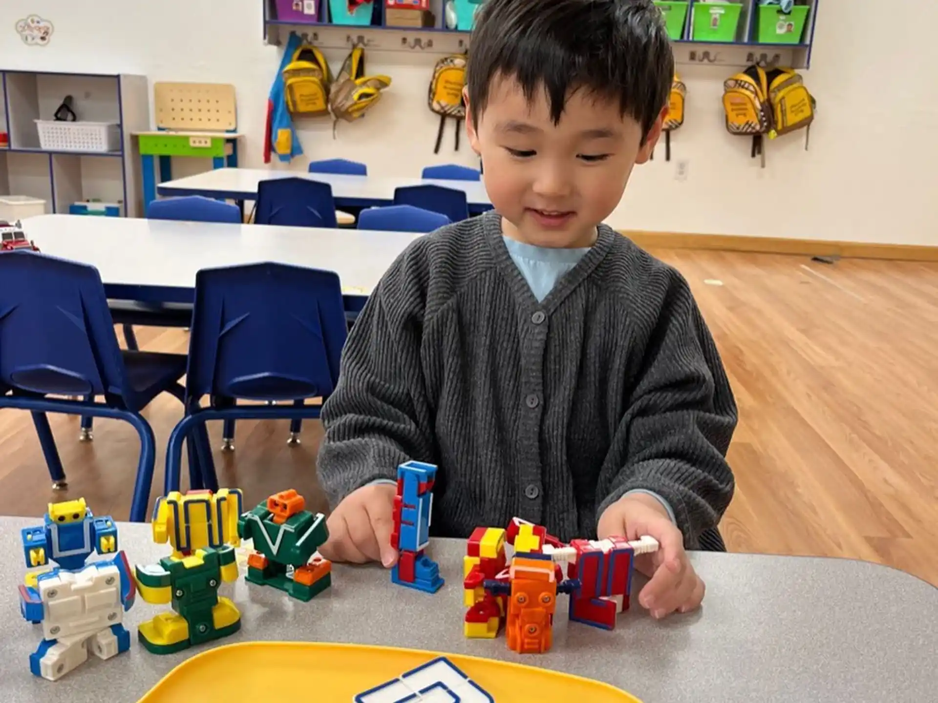 a boy playing with toys