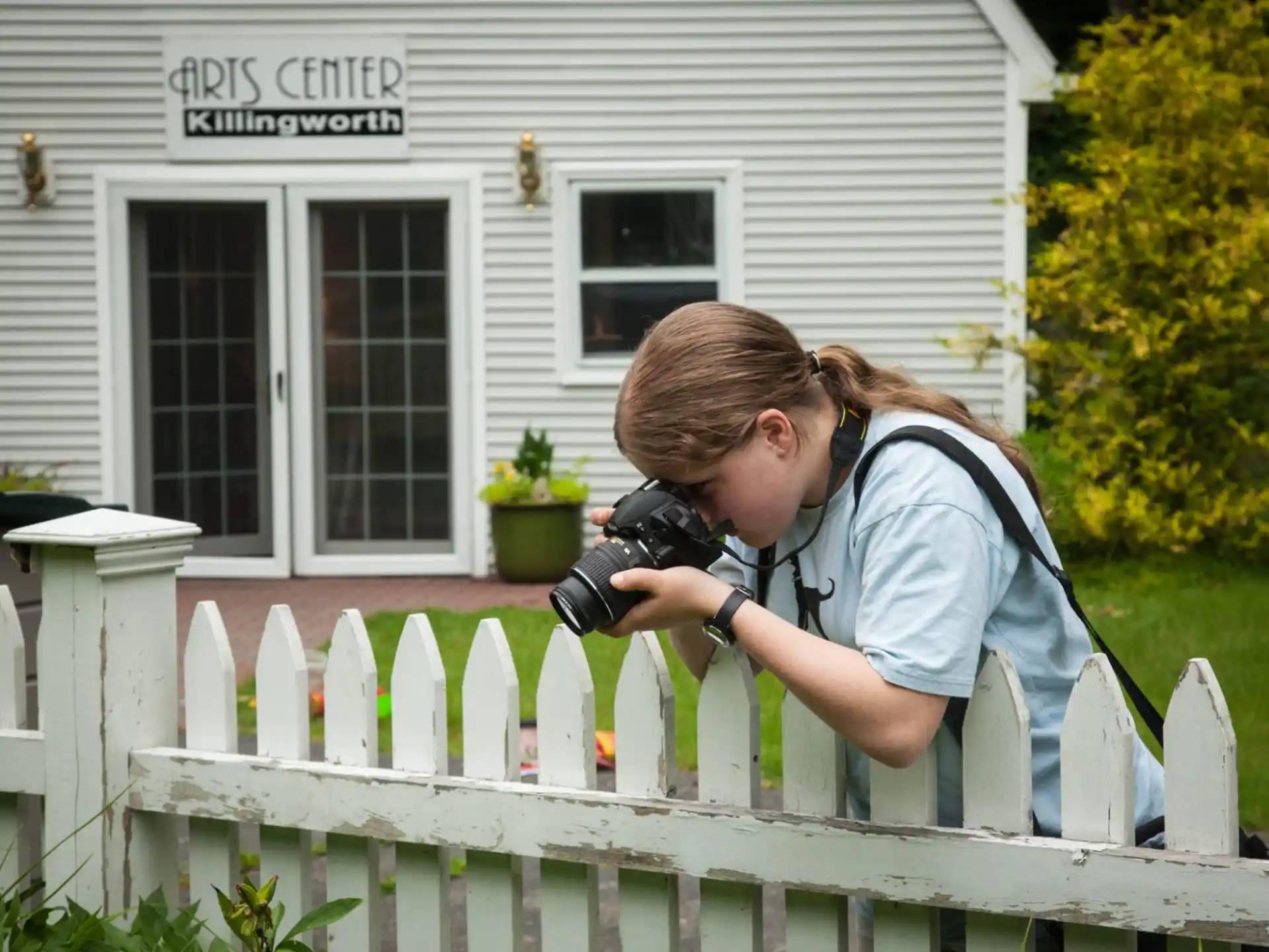 a person taking a picture of a house