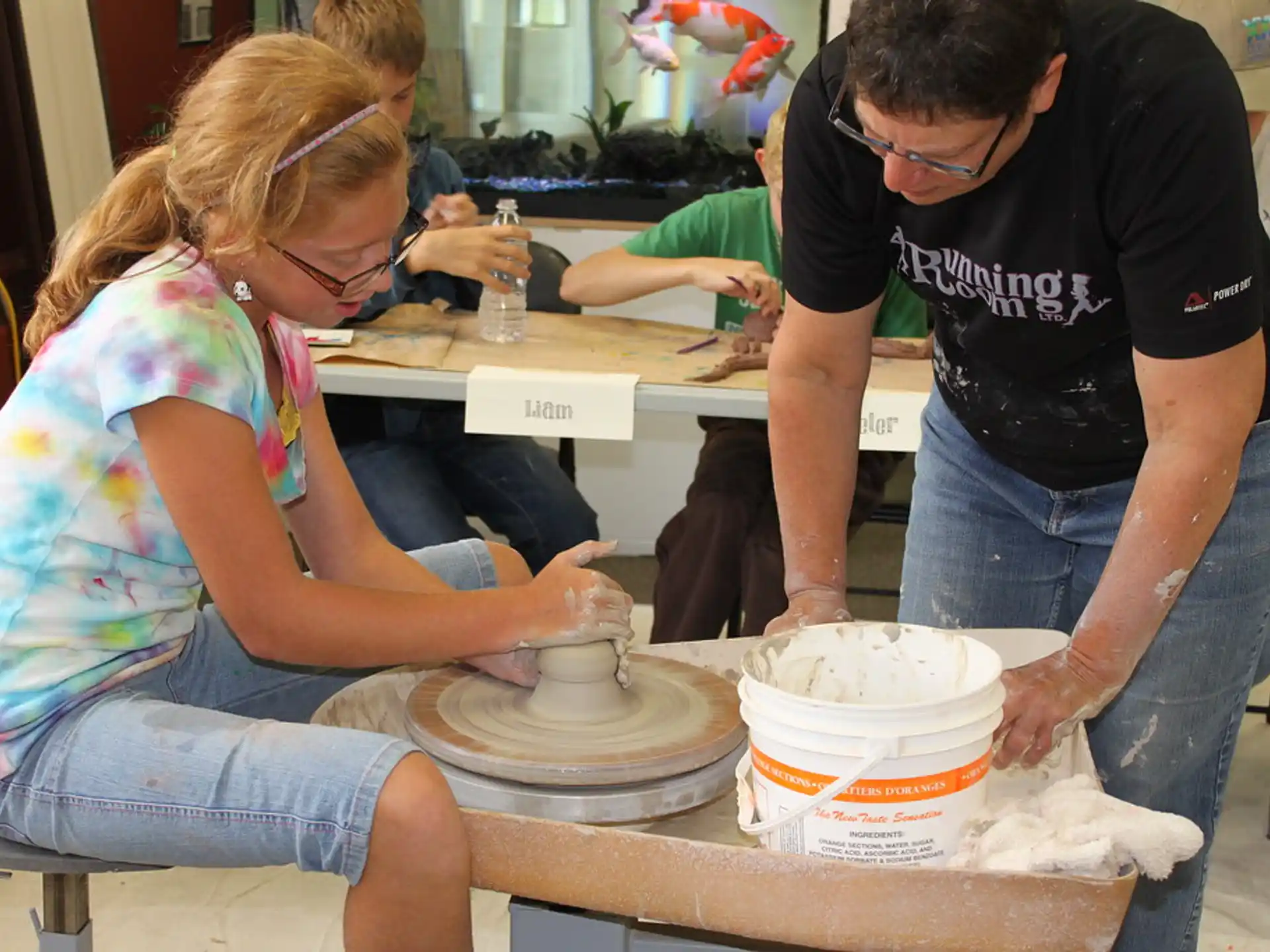 a woman and a man making a cake