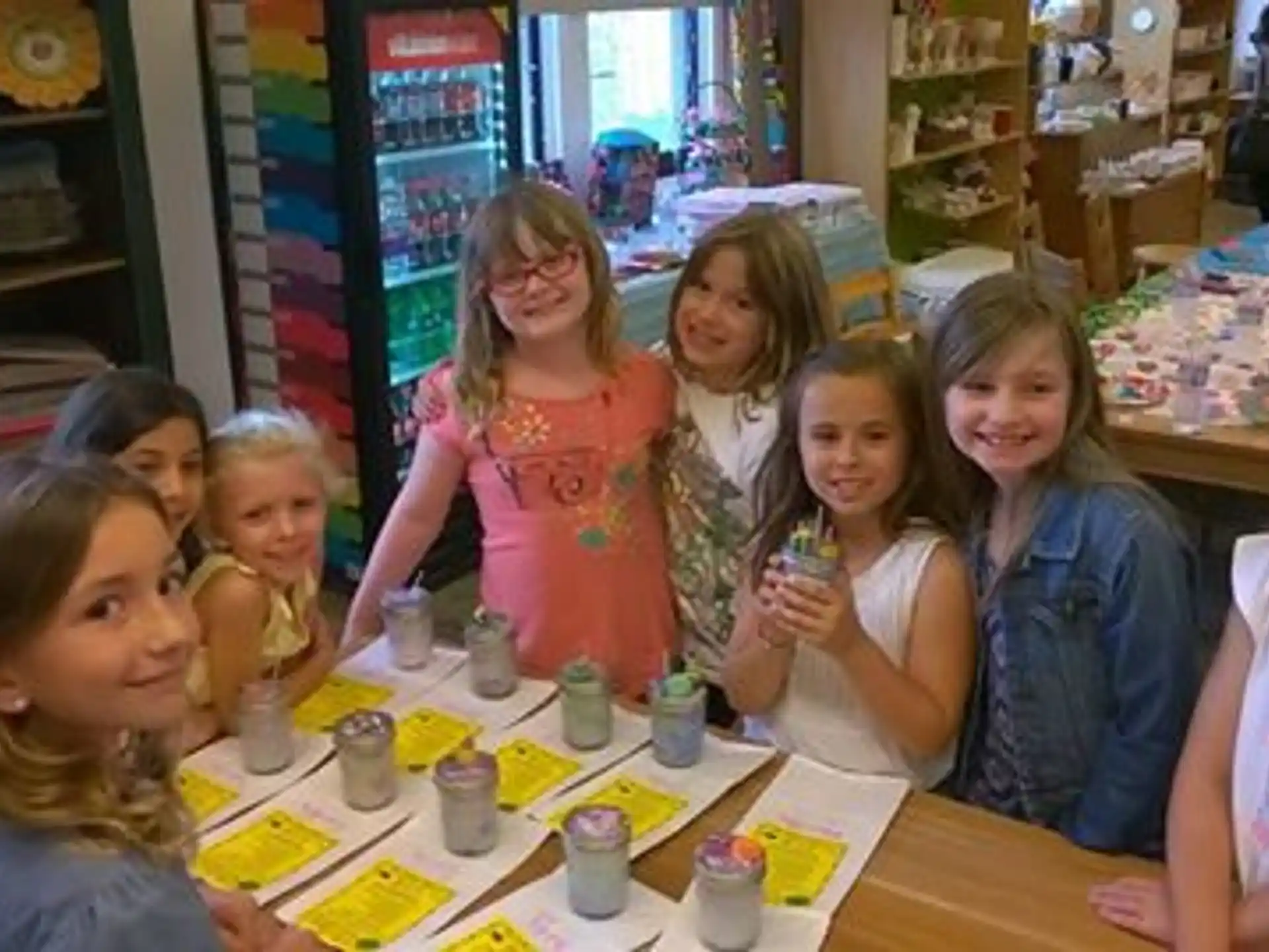 a group of girls sitting at a table