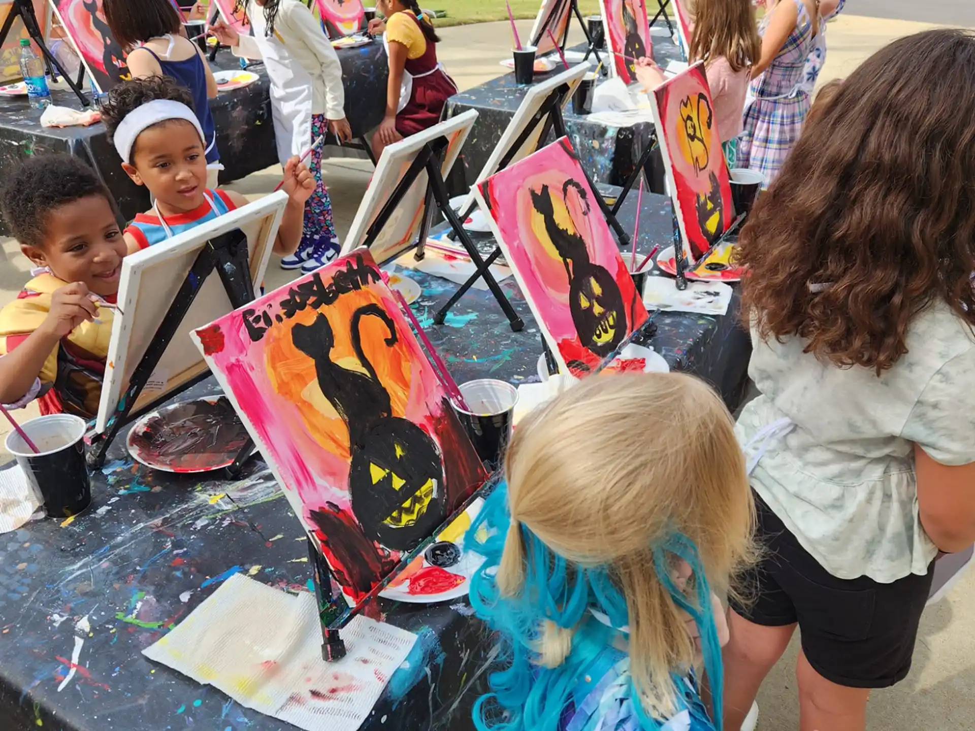 a group of people painting