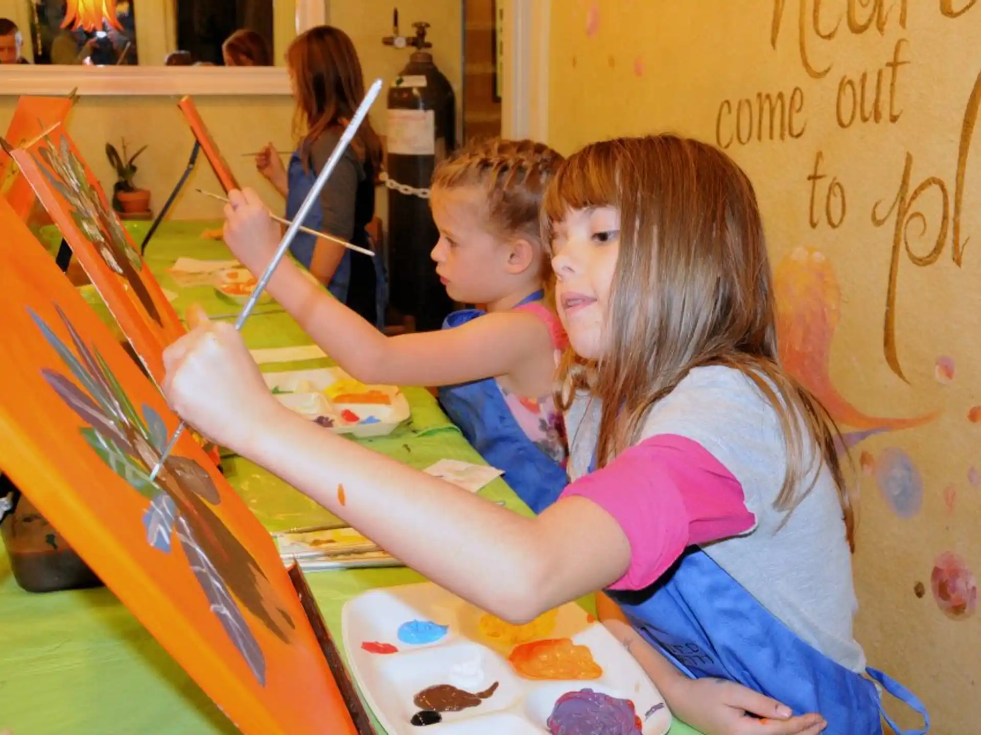 a couple of kids painting