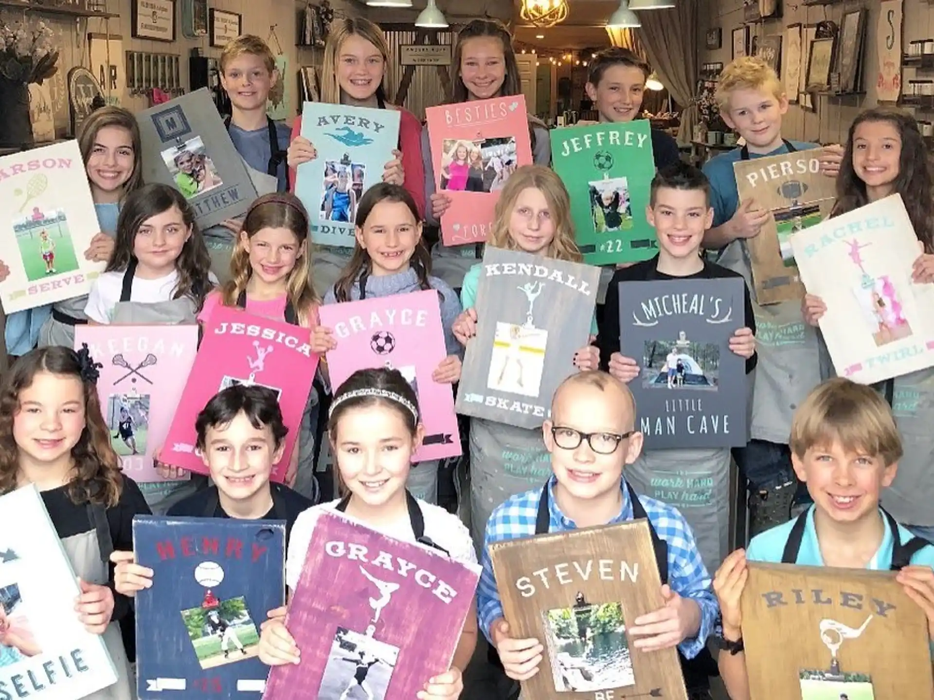 a group of children holding up books