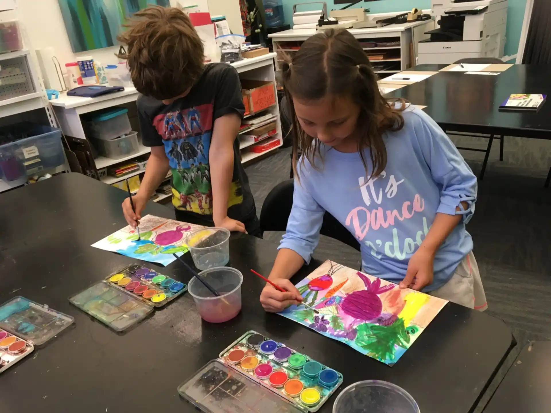 a few young girls painting