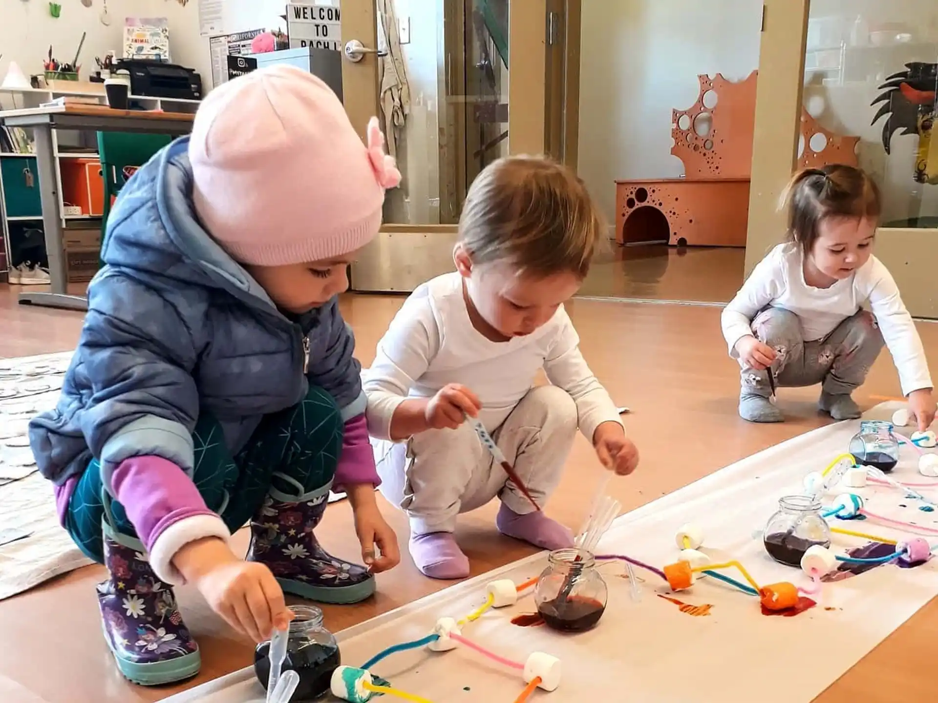 a group of children playing with toys