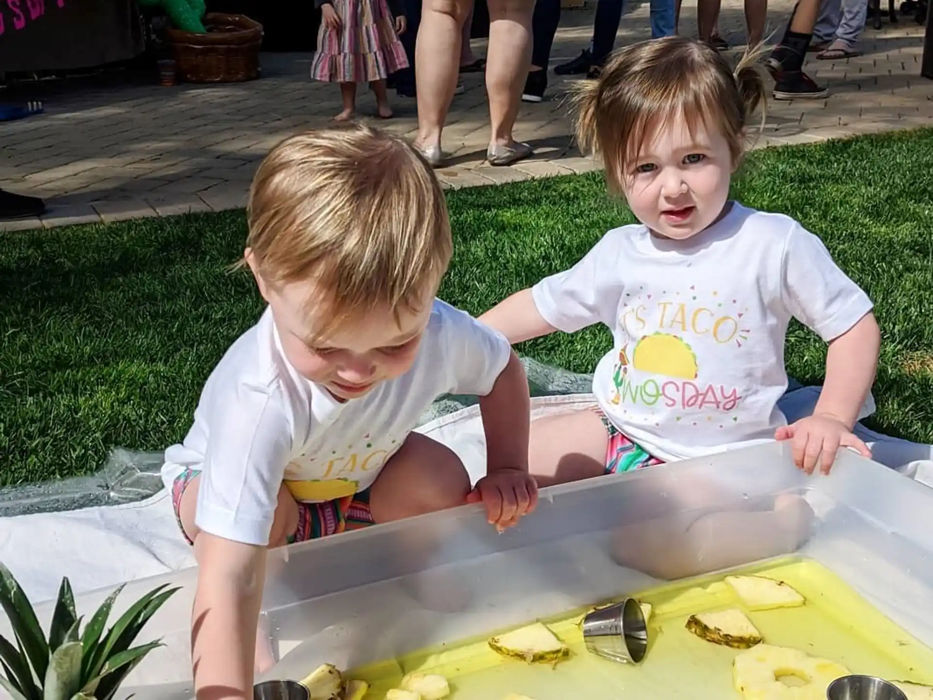 two children playing in a pool
