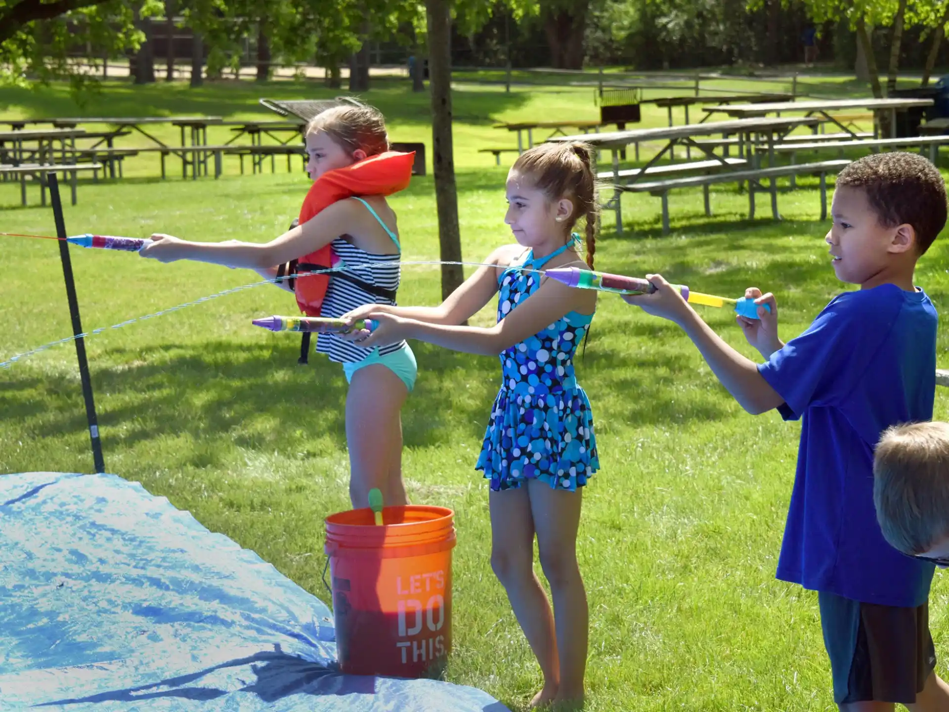 a group of children playing in a yard